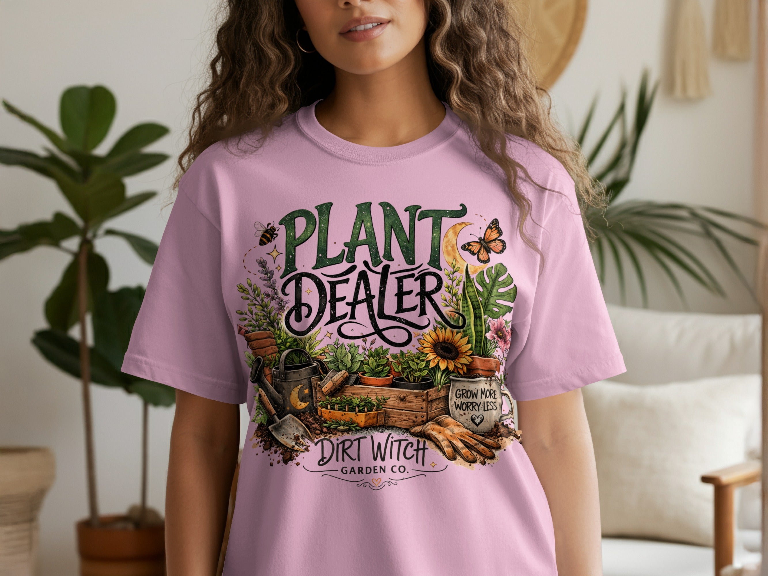 Pink t-shirt with "Plant Dealer" and "Dirt Witch Garden Co." text, surrounding gardening graphics.