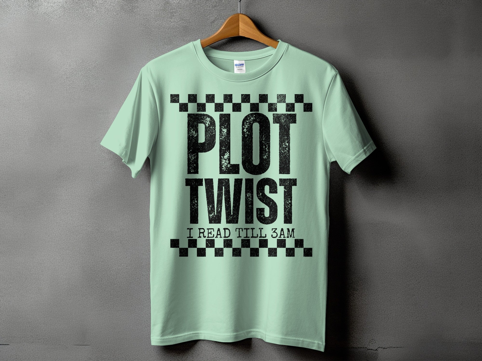 Light green t-shirt with black text "PLOT TWIST I READ TILL 3AM".