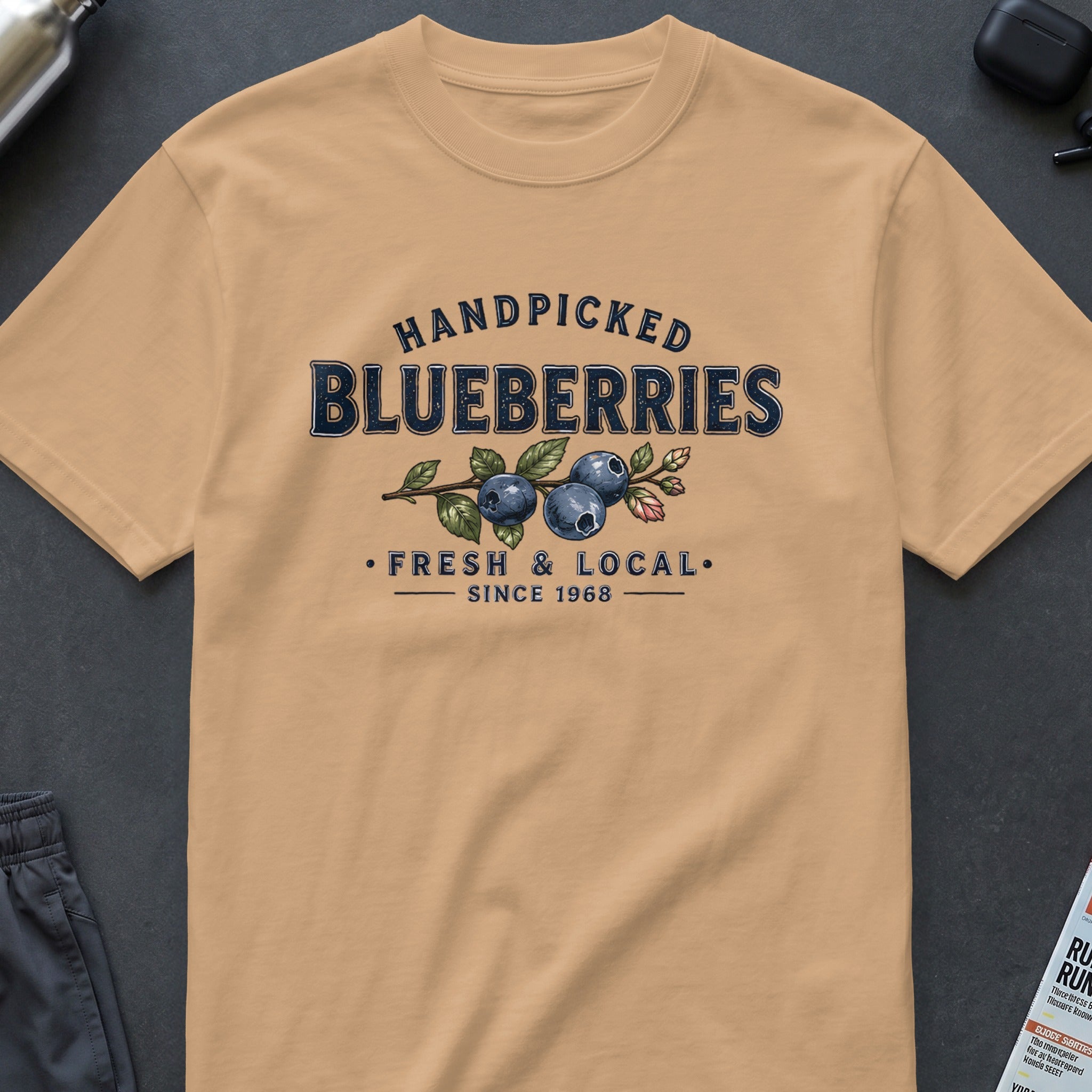 T-shirt with vintage "Handpicked Blueberries Fresh & Local Since 1968" graphic.