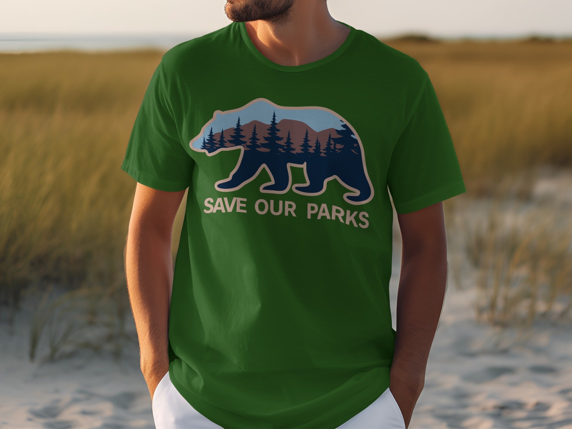 Green t-shirt with bear silhouette filled with forest and mountains, text "SAVE OUR PARKS".