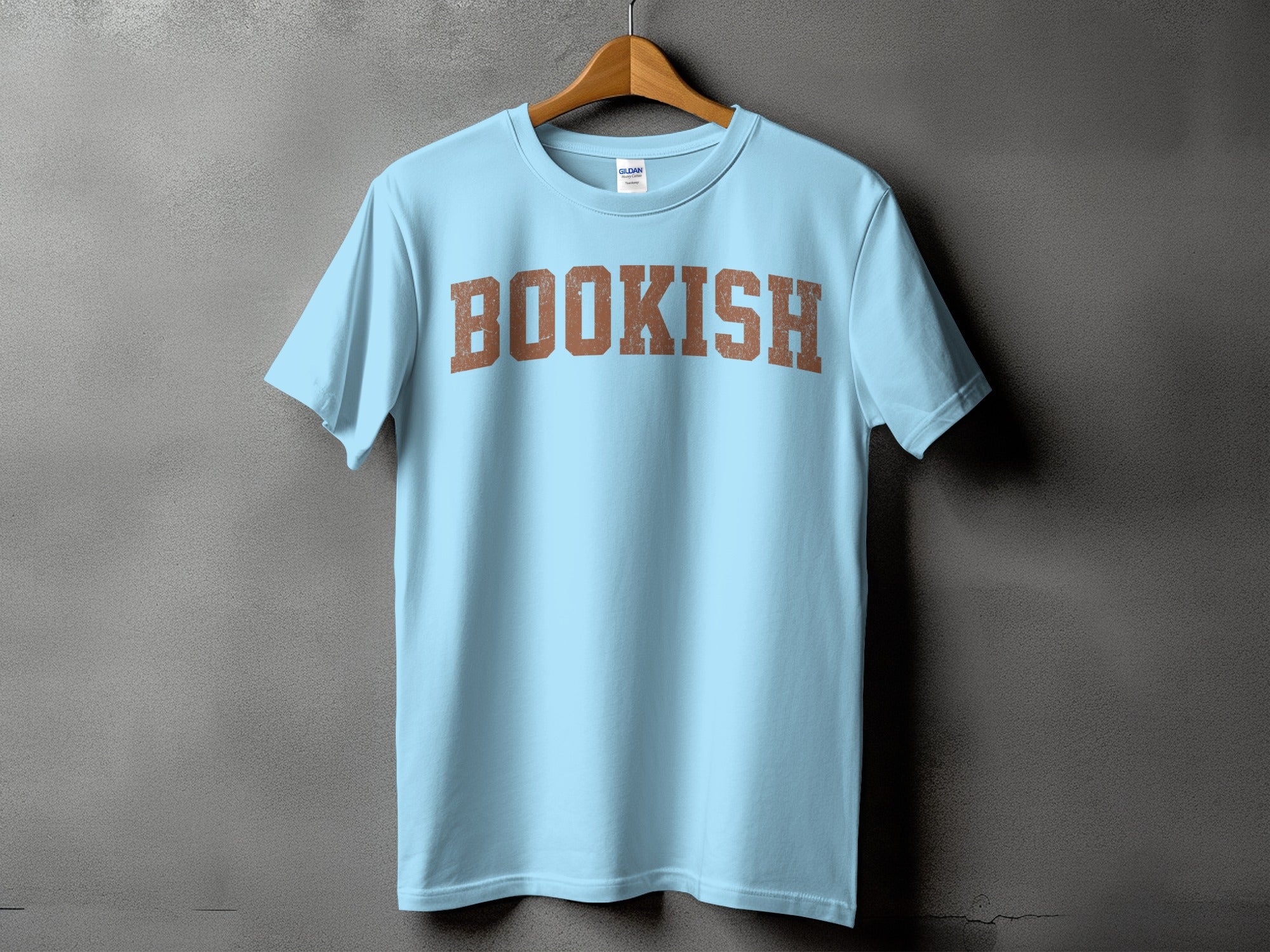 Light blue t-shirt with the word "BOOKISH" in distressed brown block letters.