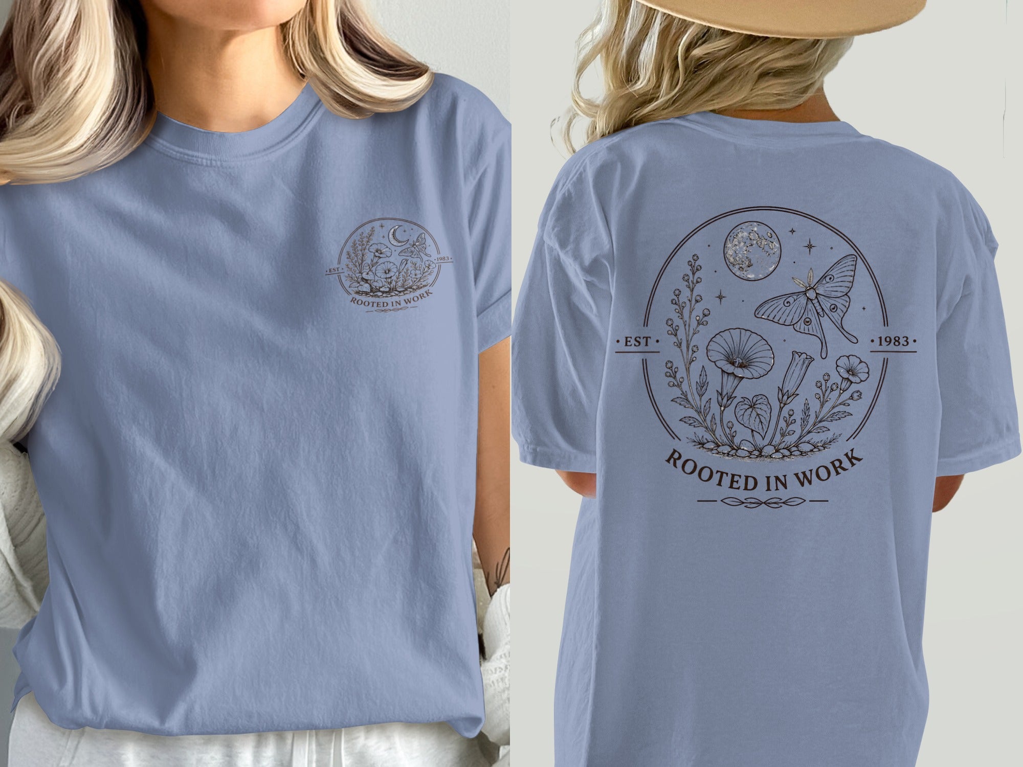 Light blue t-shirt with circular design featuring moon, moth, and plants, text "ROOTED IN WORK".