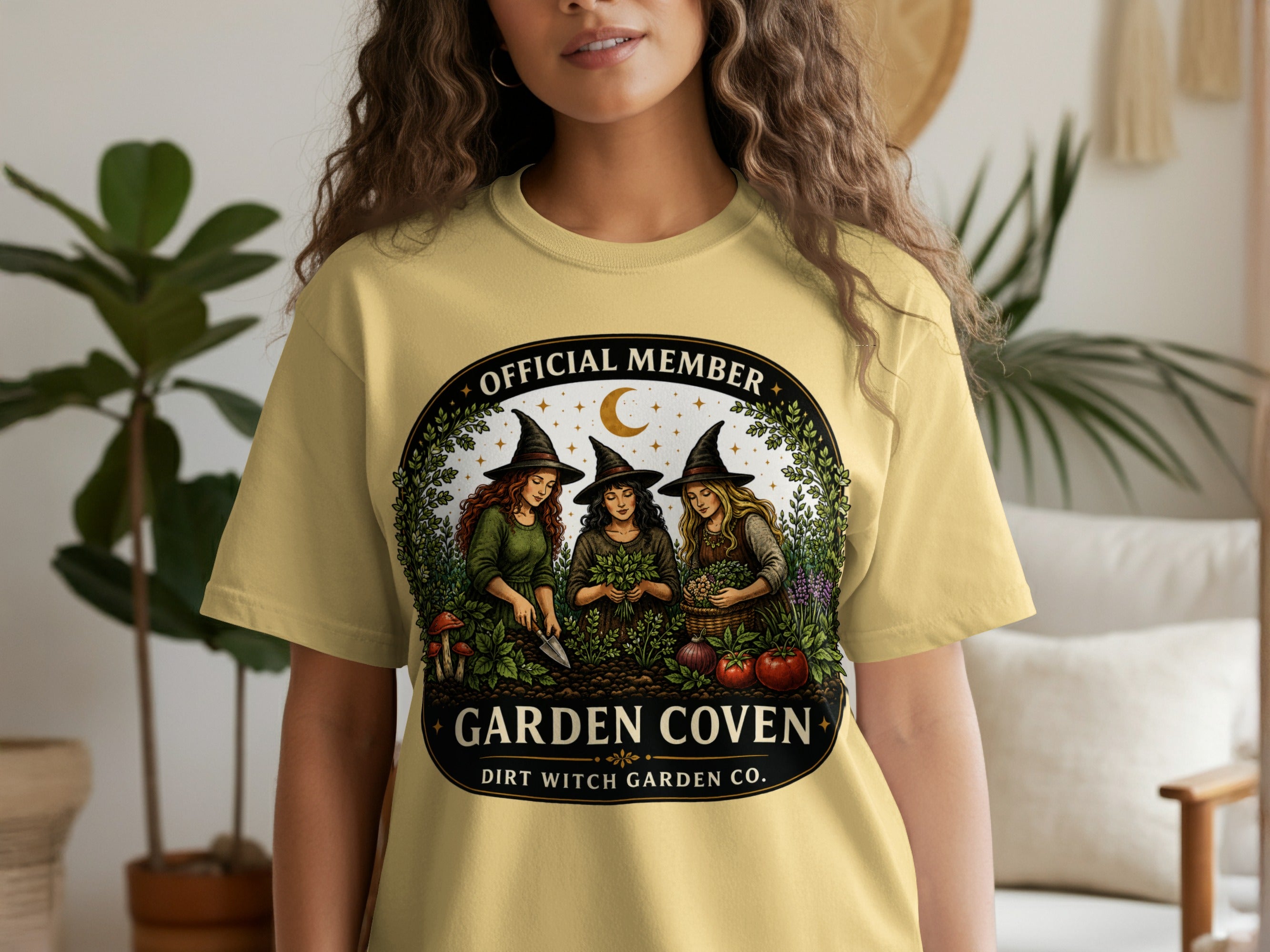 T-shirt graphic: Three witches gardening, "Official Member Garden Coven" text.