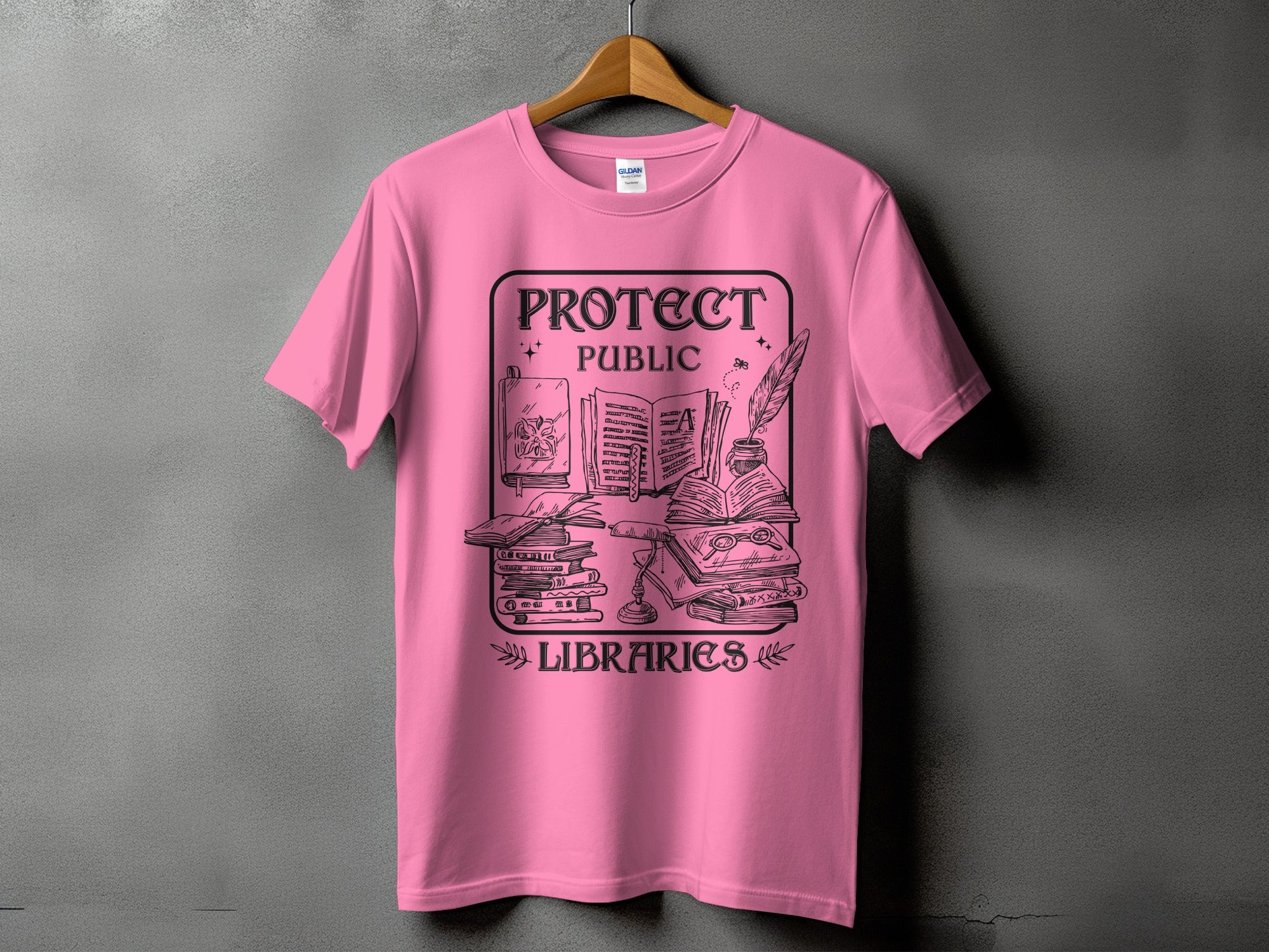 Pink t-shirt with black graphic: "Protect Public Libraries" and stack of books.