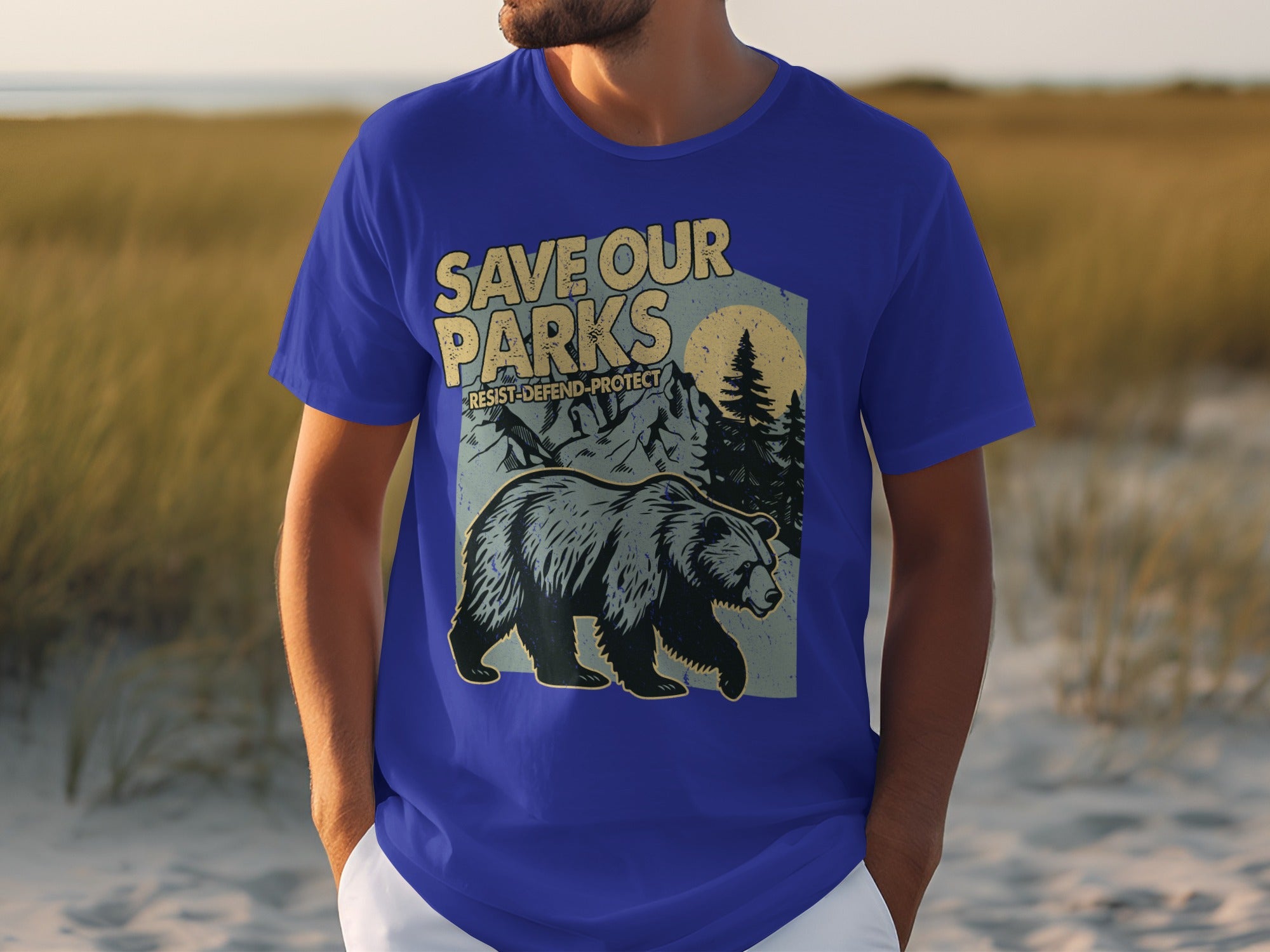 Blue t-shirt with "SAVE OUR PARKS" slogan and graphic of a bear, mountains, and trees.