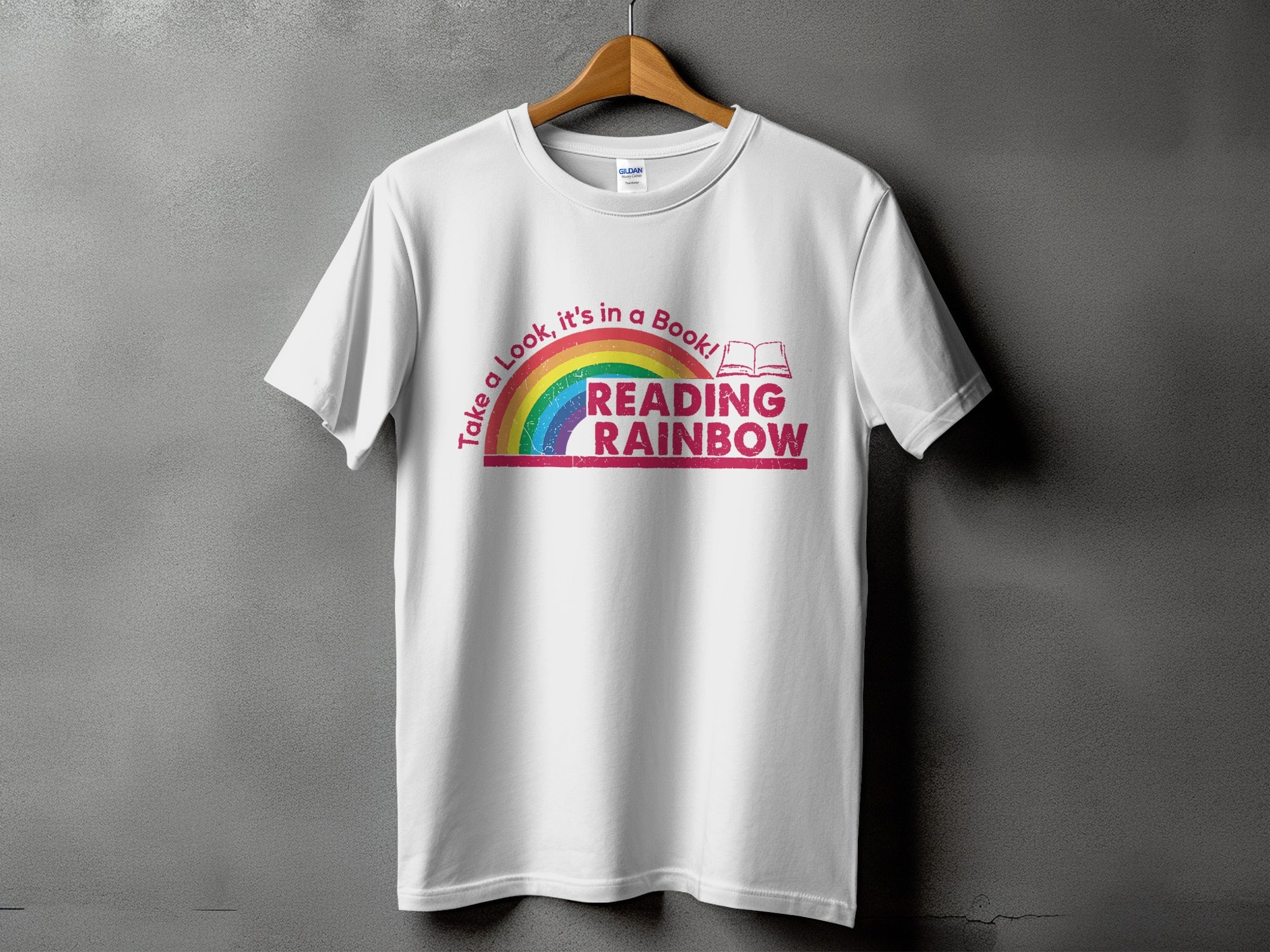 White t-shirt with "Reading Rainbow" text and a rainbow graphic.