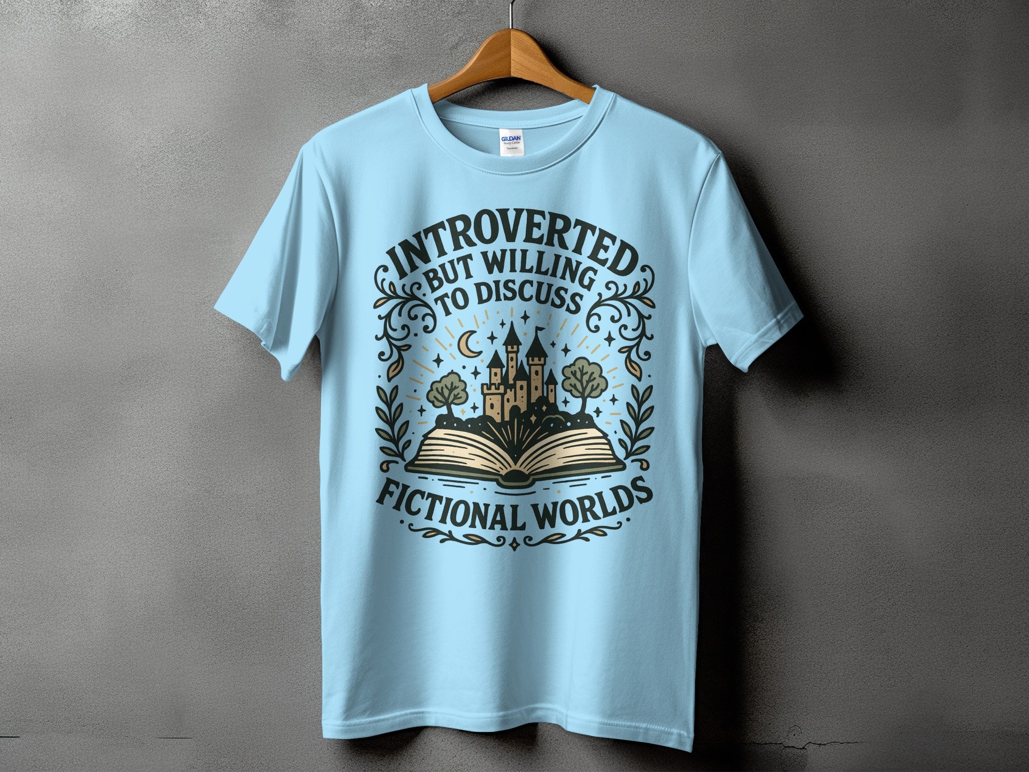Light blue t-shirt with "Introverted but willing to discuss fictional worlds" graphic.