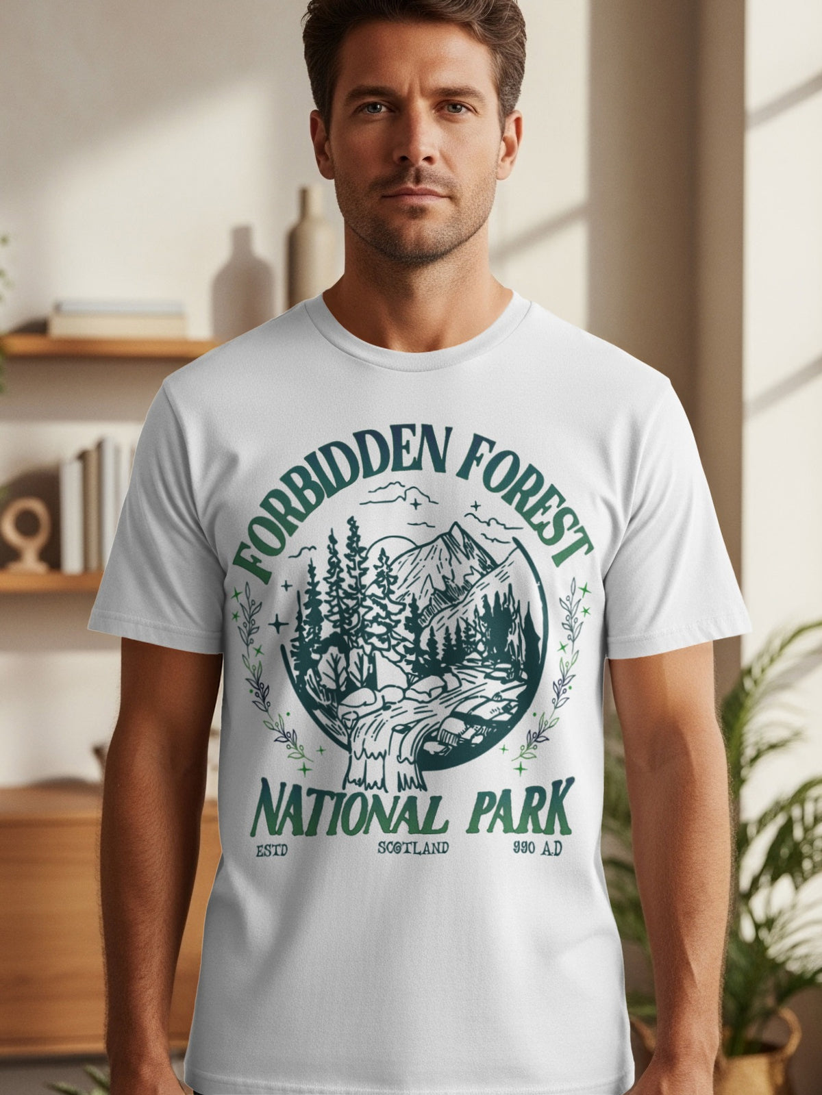 White t-shirt with circular graphic reading "Forbidden Forest National Park Scotland 990 AD".