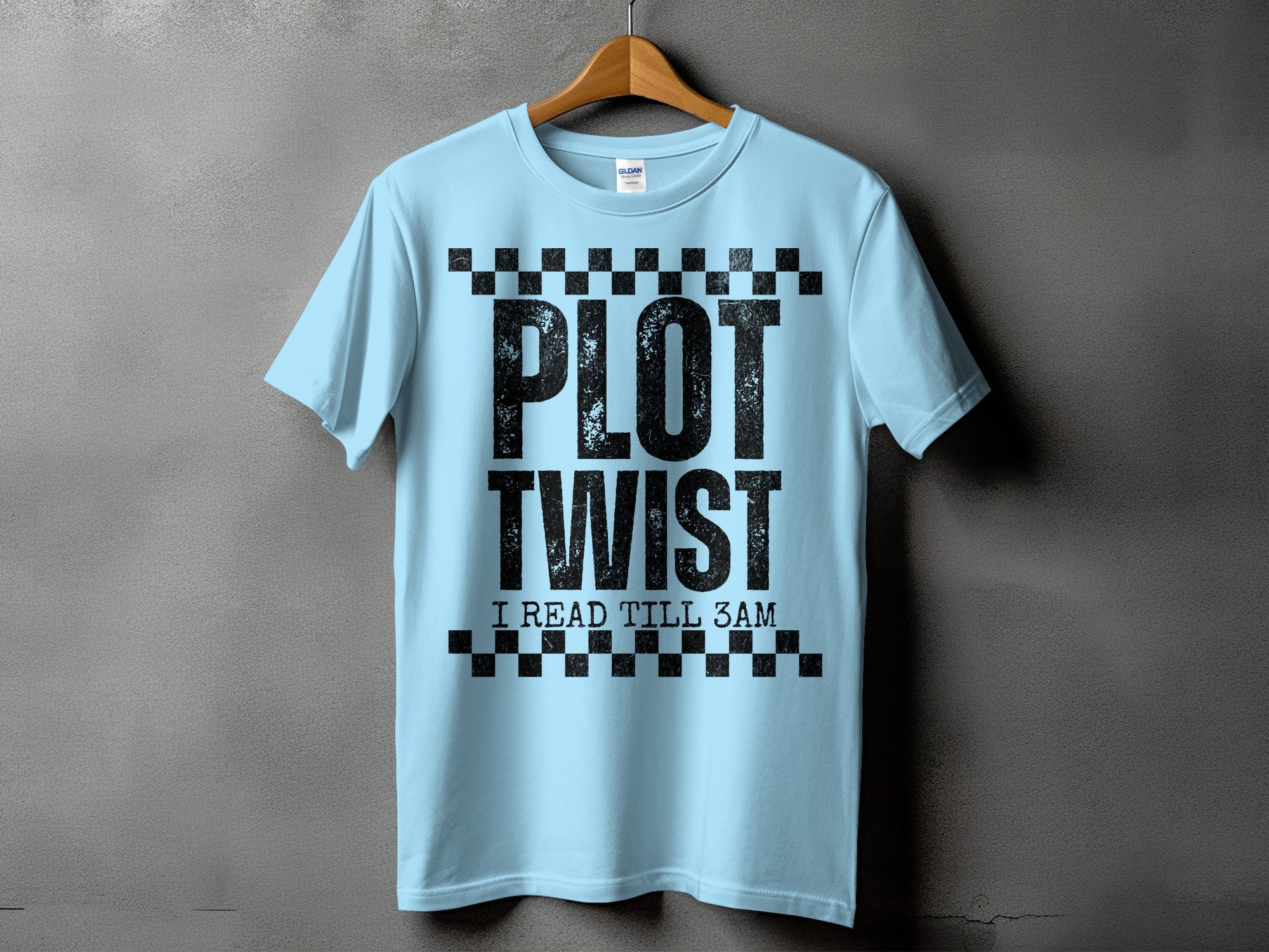 Light blue t-shirt with distressed black "PLOT TWIST I READ TILL 3AM" text.