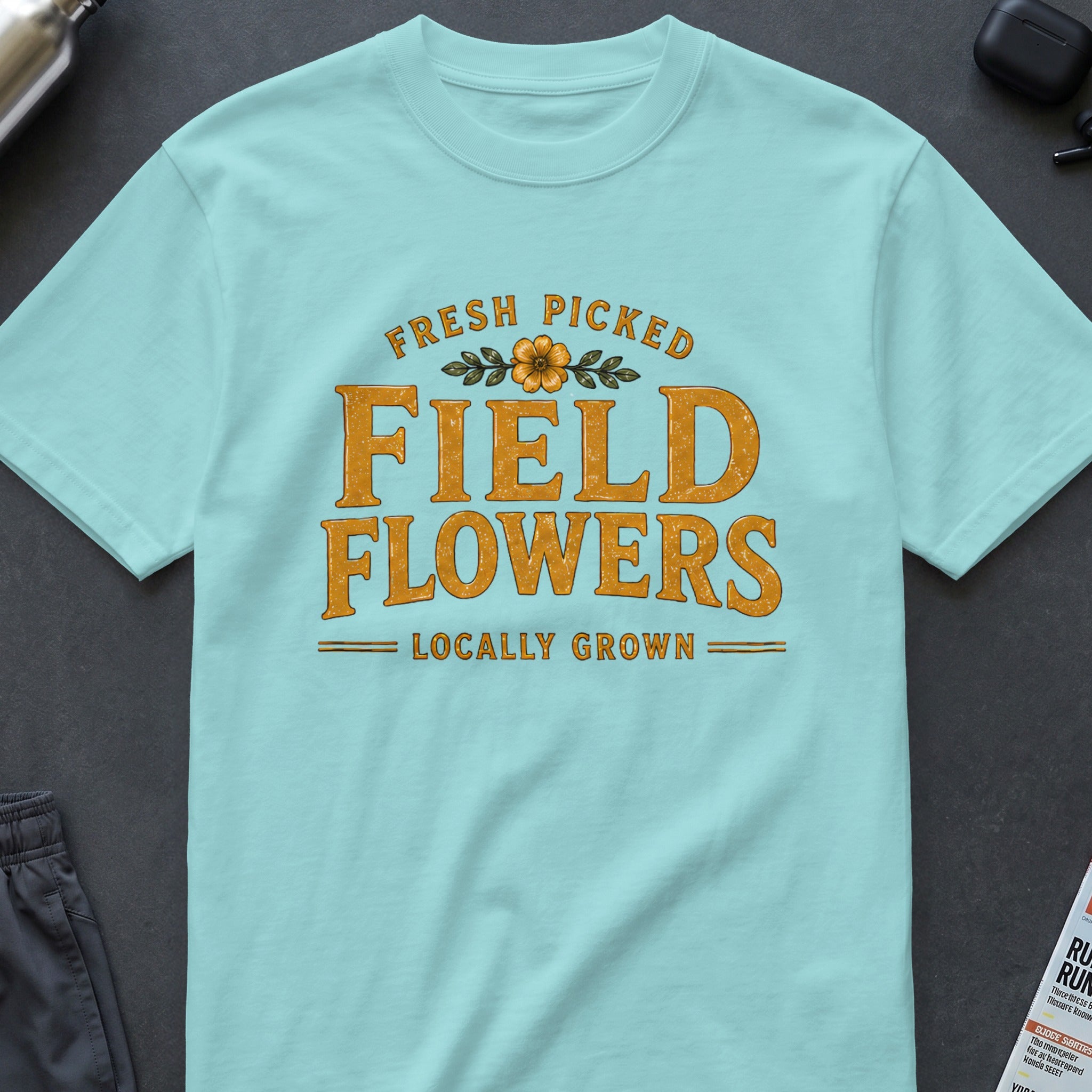 Light blue t-shirt with "Fresh Picked Field Flowers Locally Grown" text.