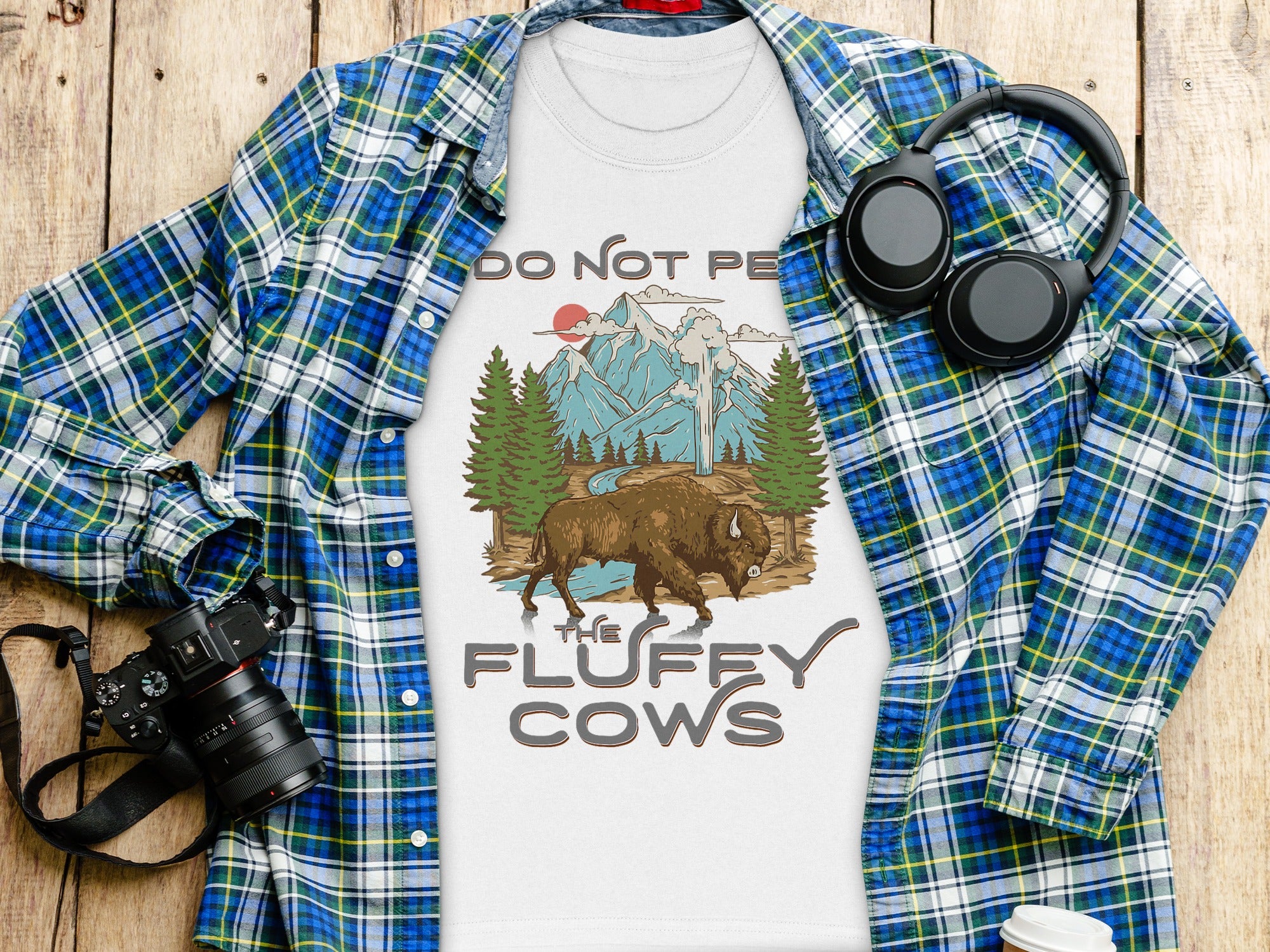T-shirt with bison, mountains, and text "Do Not Pet The Fluffy Cows".