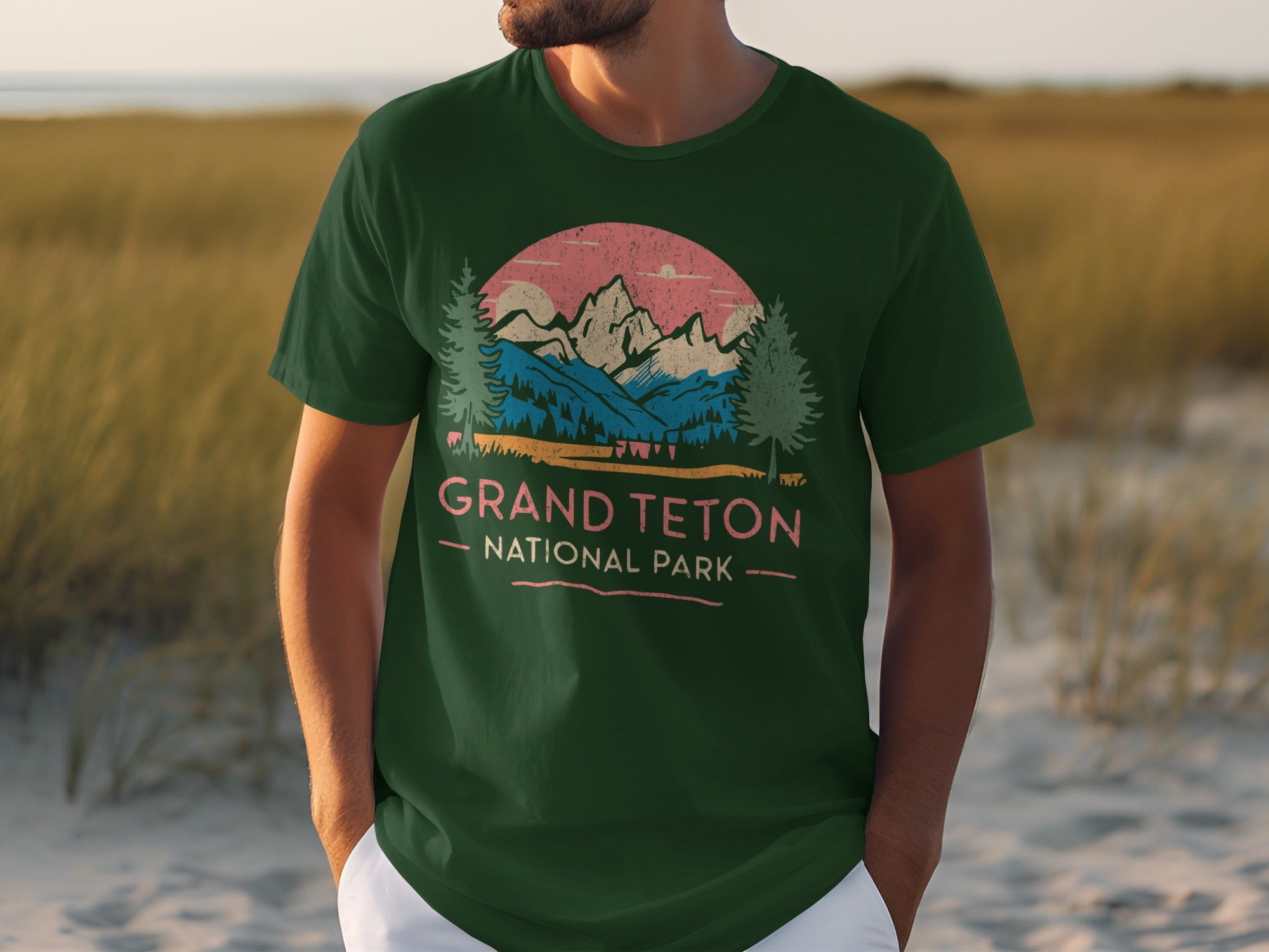 Green t-shirt with Grand Teton National Park mountain graphic and text