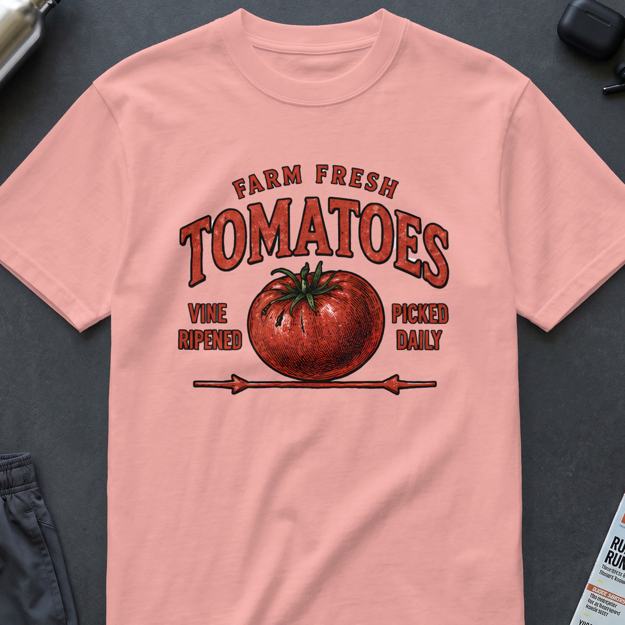 Pink t-shirt with a distressed graphic of a tomato and text: Farm Fresh Tomatoes, Vine Ripened, Picked Daily.