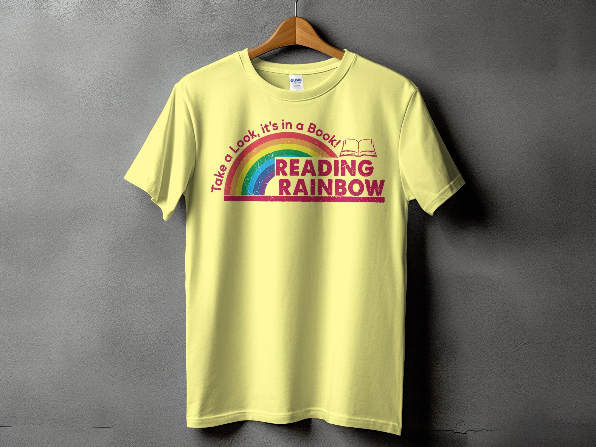 Yellow t-shirt with "Reading Rainbow" text and a rainbow graphic.