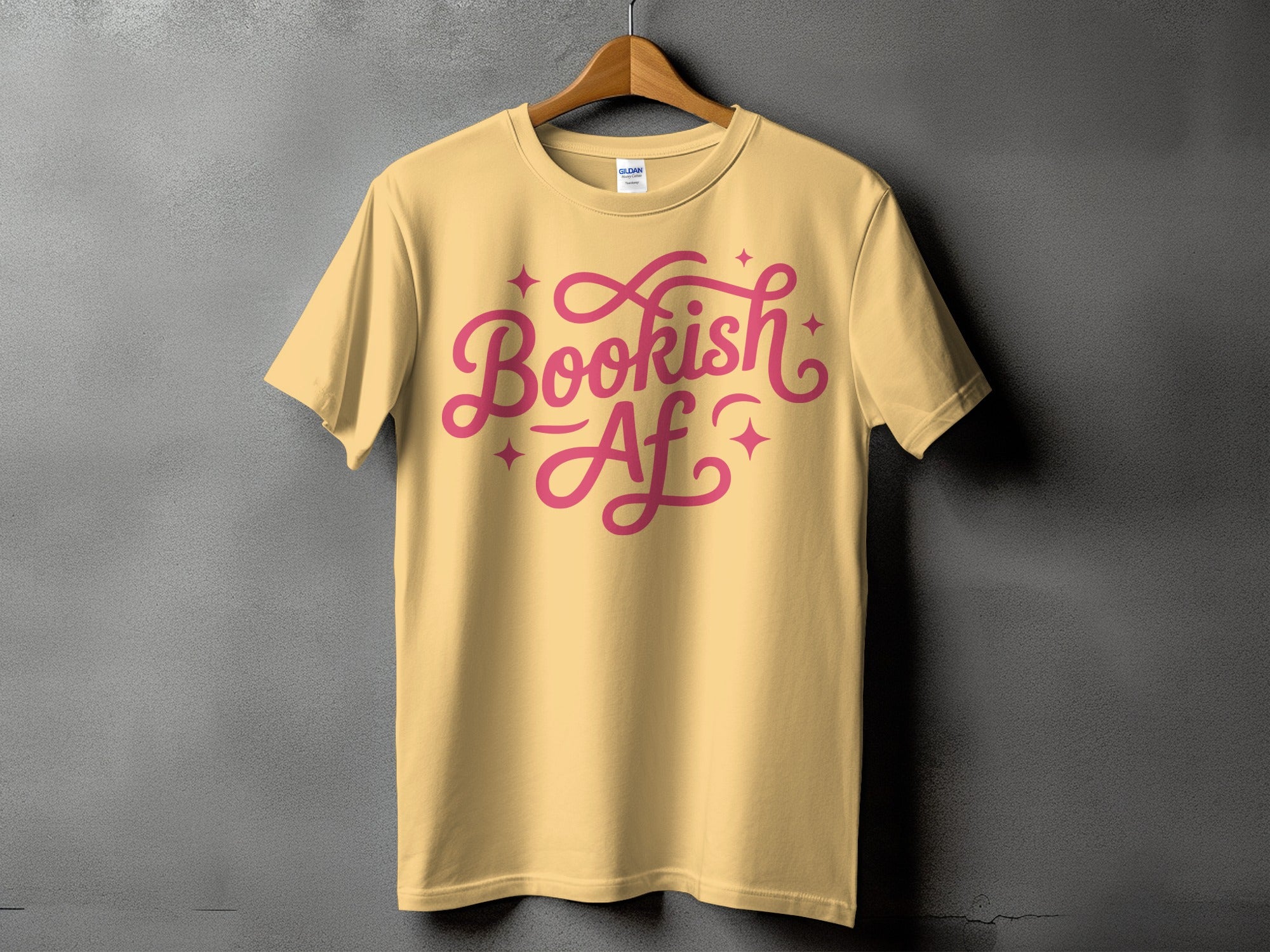 Yellow t-shirt with pink "Bookish Af" text and stars design.