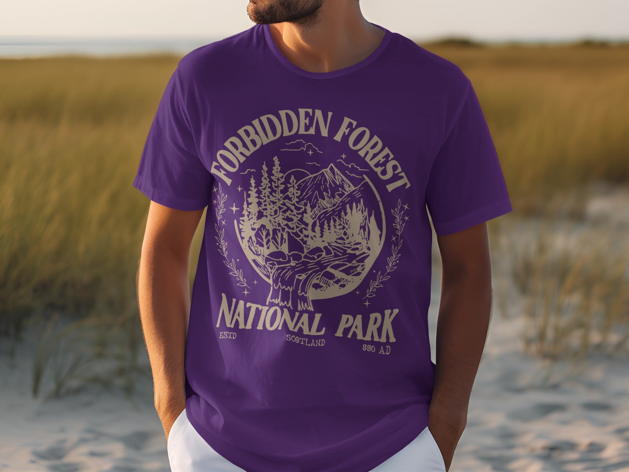 Purple t-shirt with cream graphic for Forbidden Forest National Park Scotland.