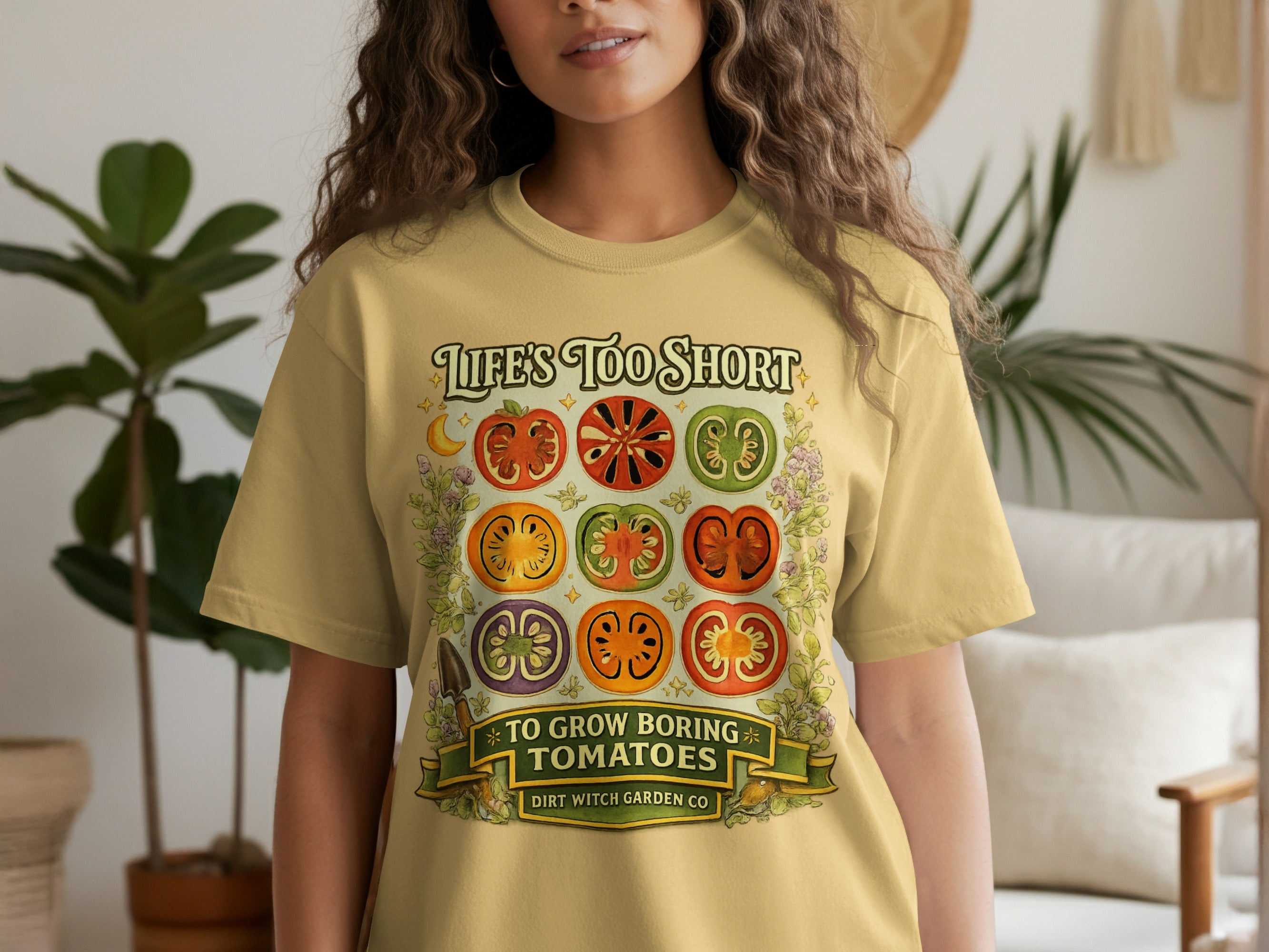 Yellow t-shirt with a graphic of sliced tomatoes and text "LIFE'S TOO SHORT TO GROW BORING TOMATOES".