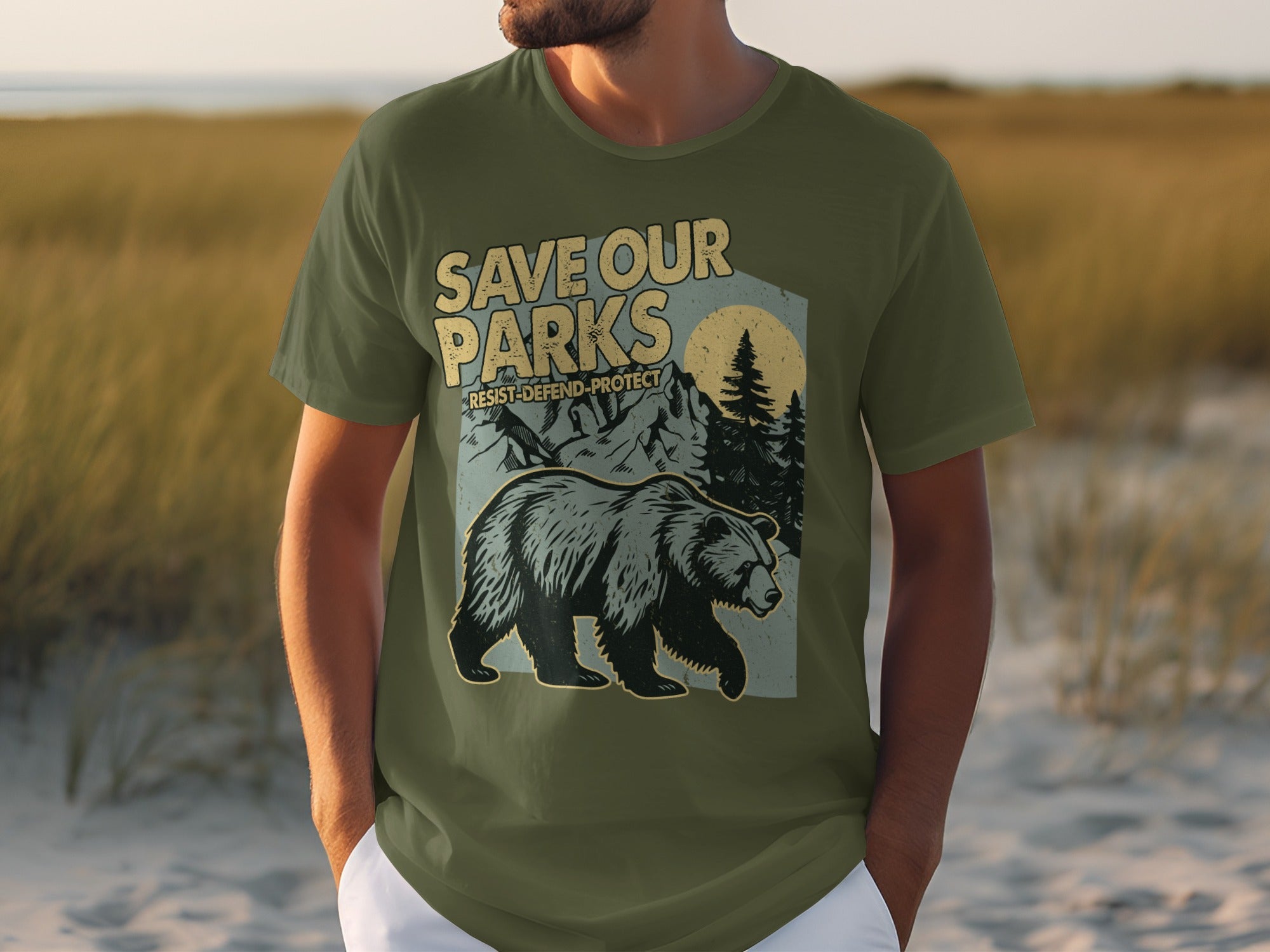 Olive green t-shirt with "Save Our Parks Resist-Defend-Protect" and bear design.
