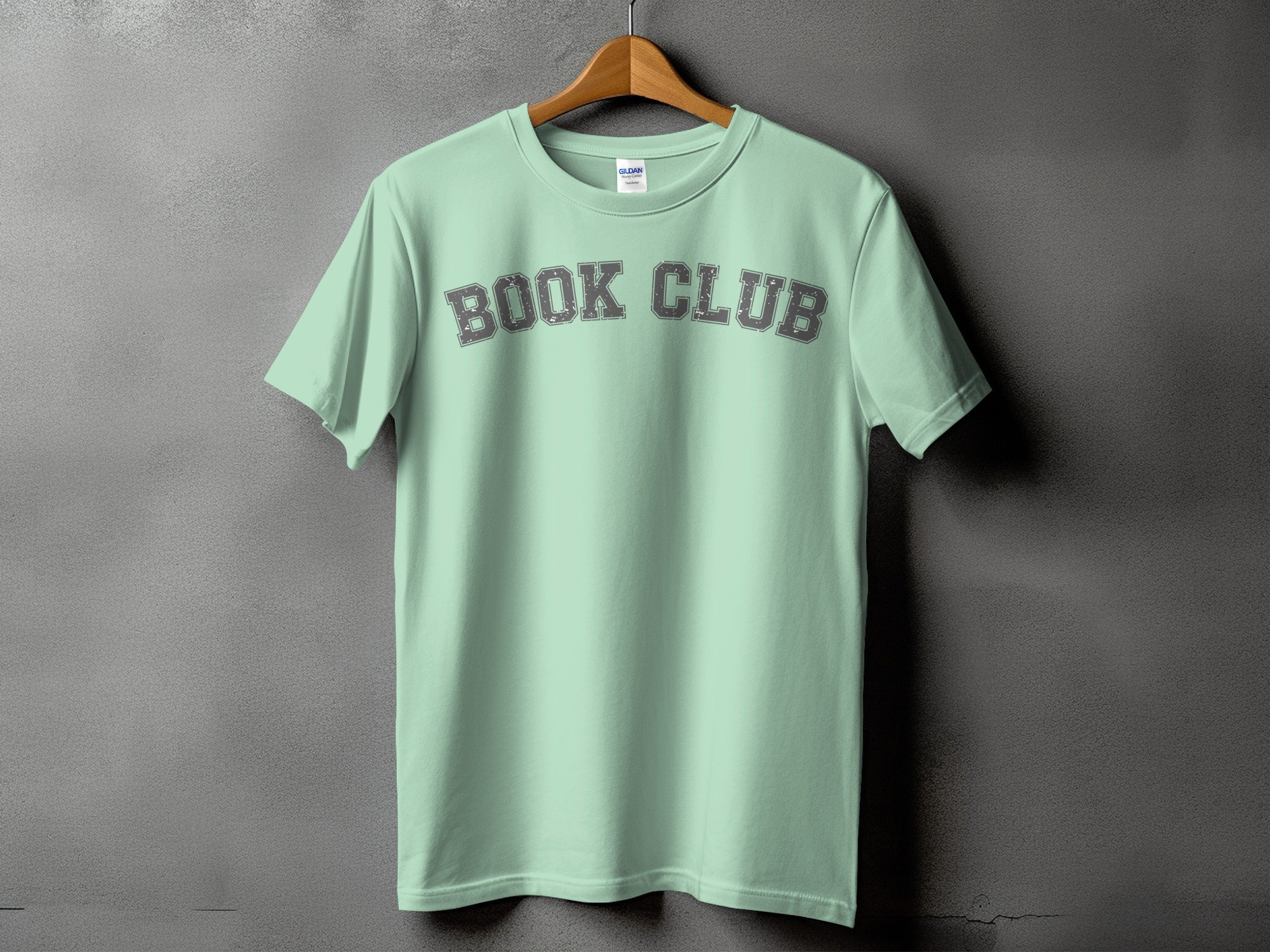 Light mint t-shirt with "BOOK CLUB" in distressed grey collegiate font.