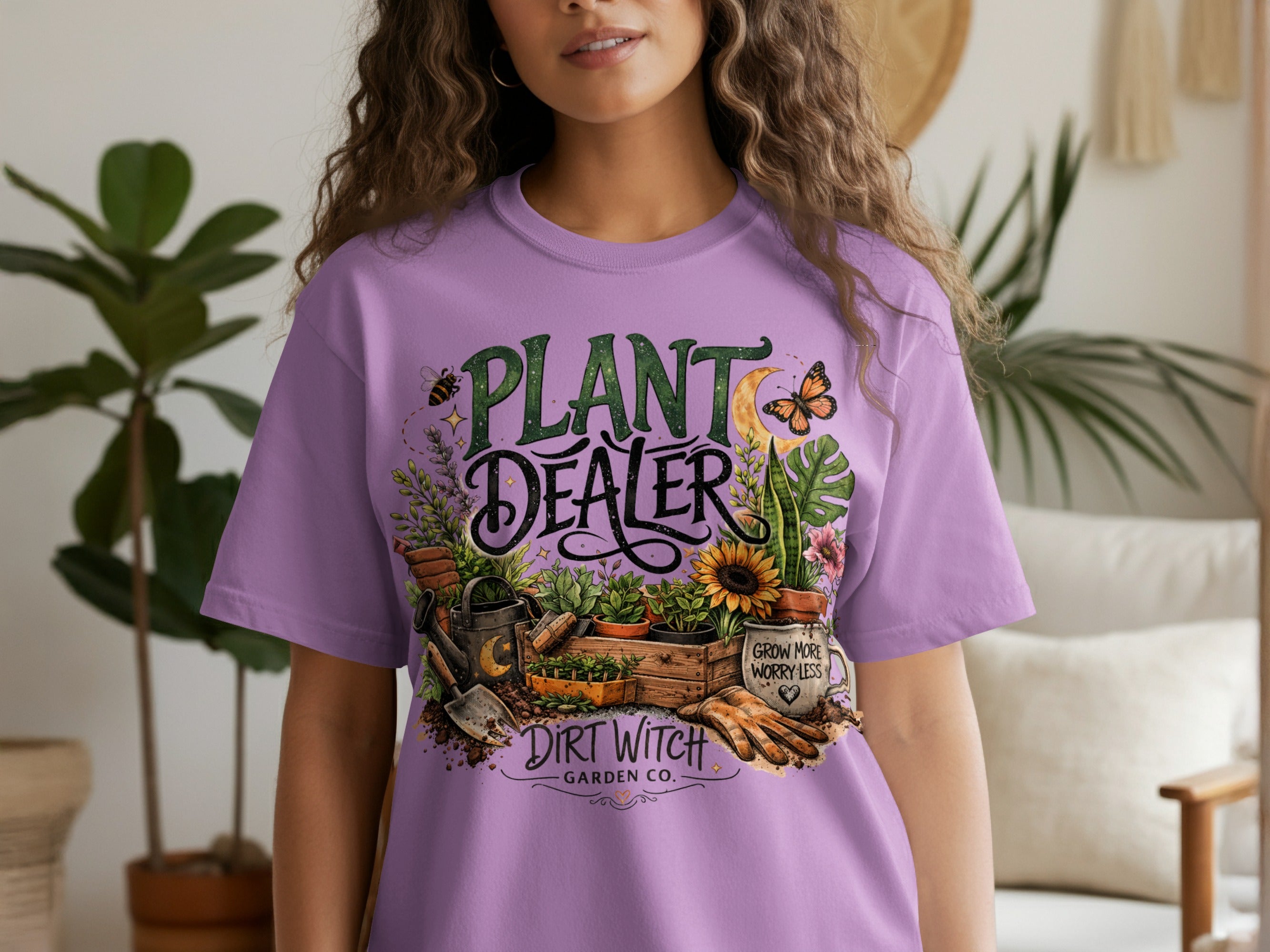 Purple t-shirt with "PLANT DEALER DIRT WITCH GARDEN CO." text and gardening graphics.