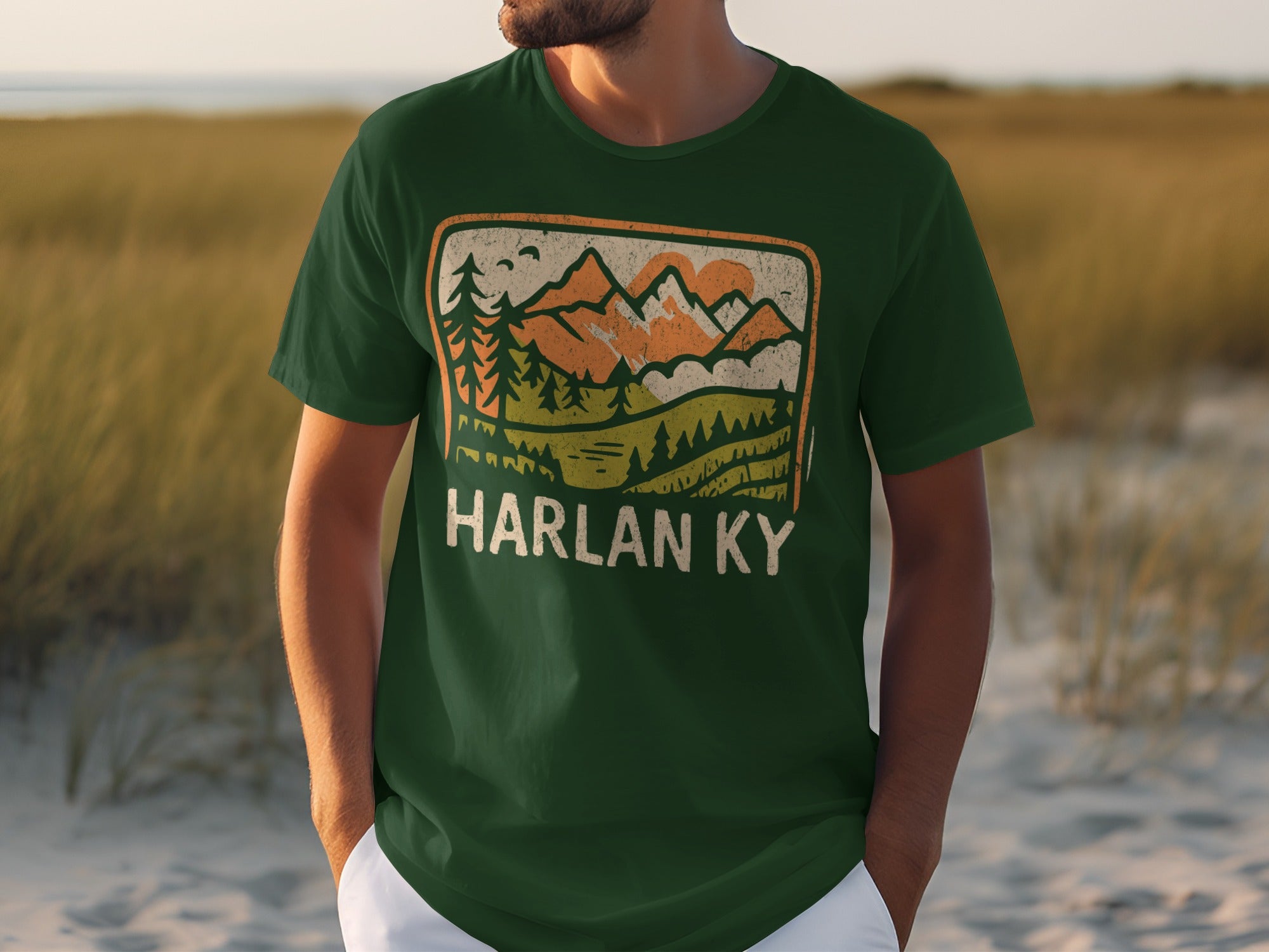 Green t-shirt with vintage landscape design and HARLAN KY text.