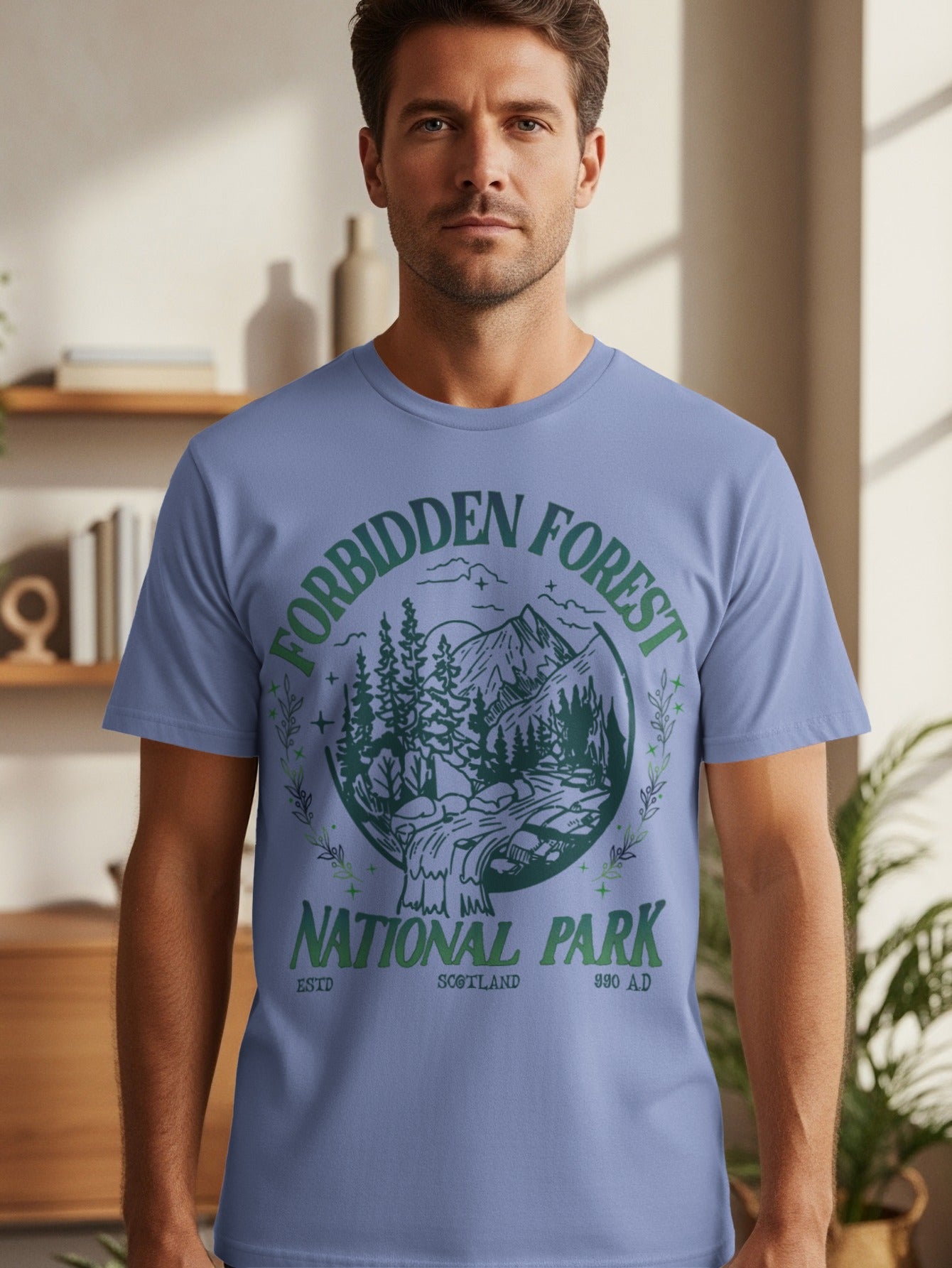 T-shirt with green circular graphic: "Forbidden Forest National Park Scotland 990 A.D."