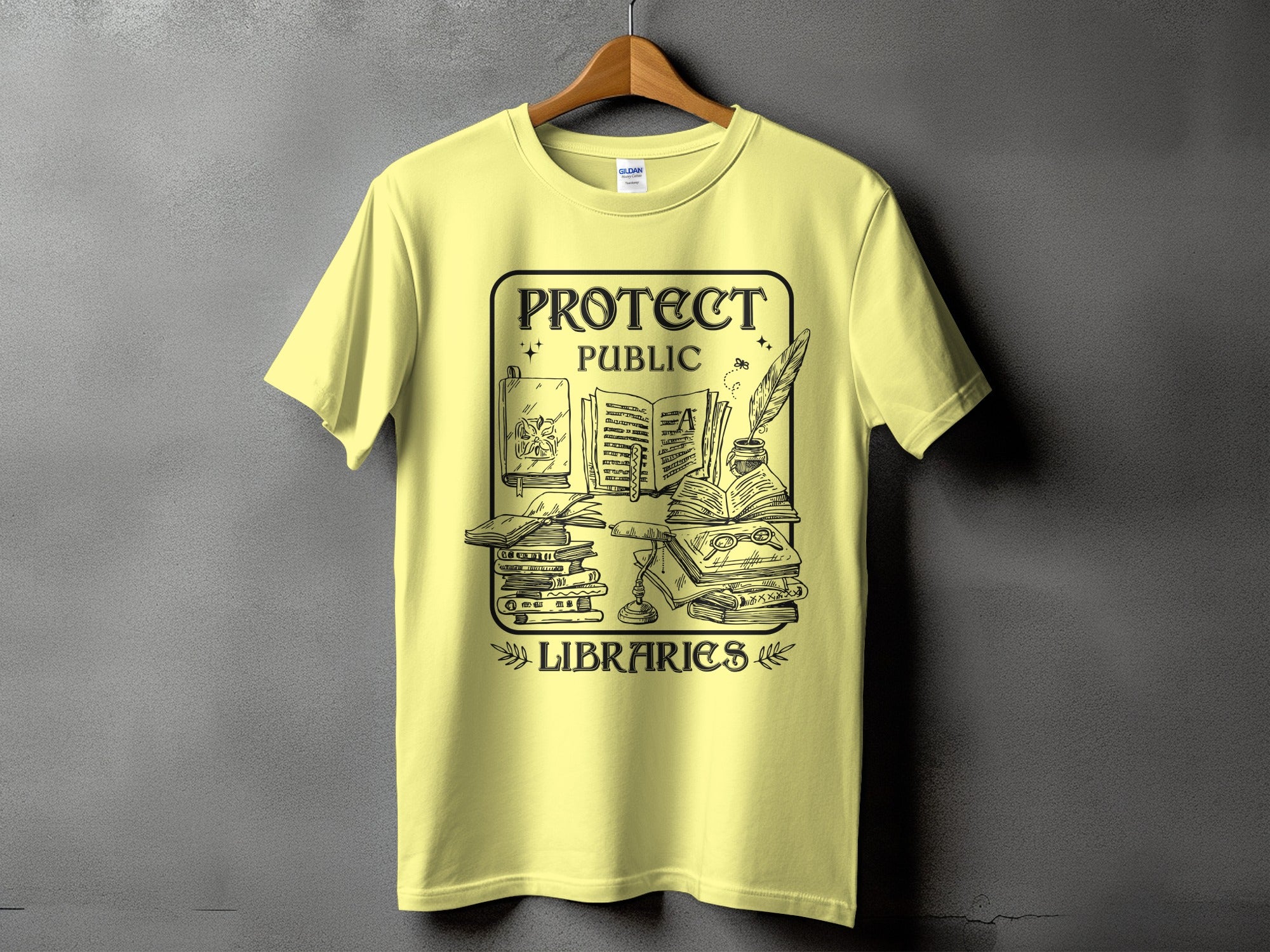 Yellow t-shirt with "Protect Public Libraries" slogan and library-themed illustration.