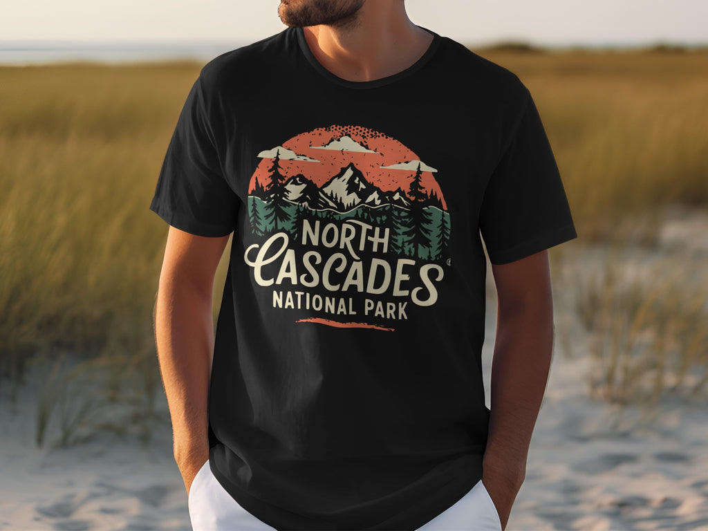 Black t-shirt with "North Cascades National Park" text and mountain landscape graphic.