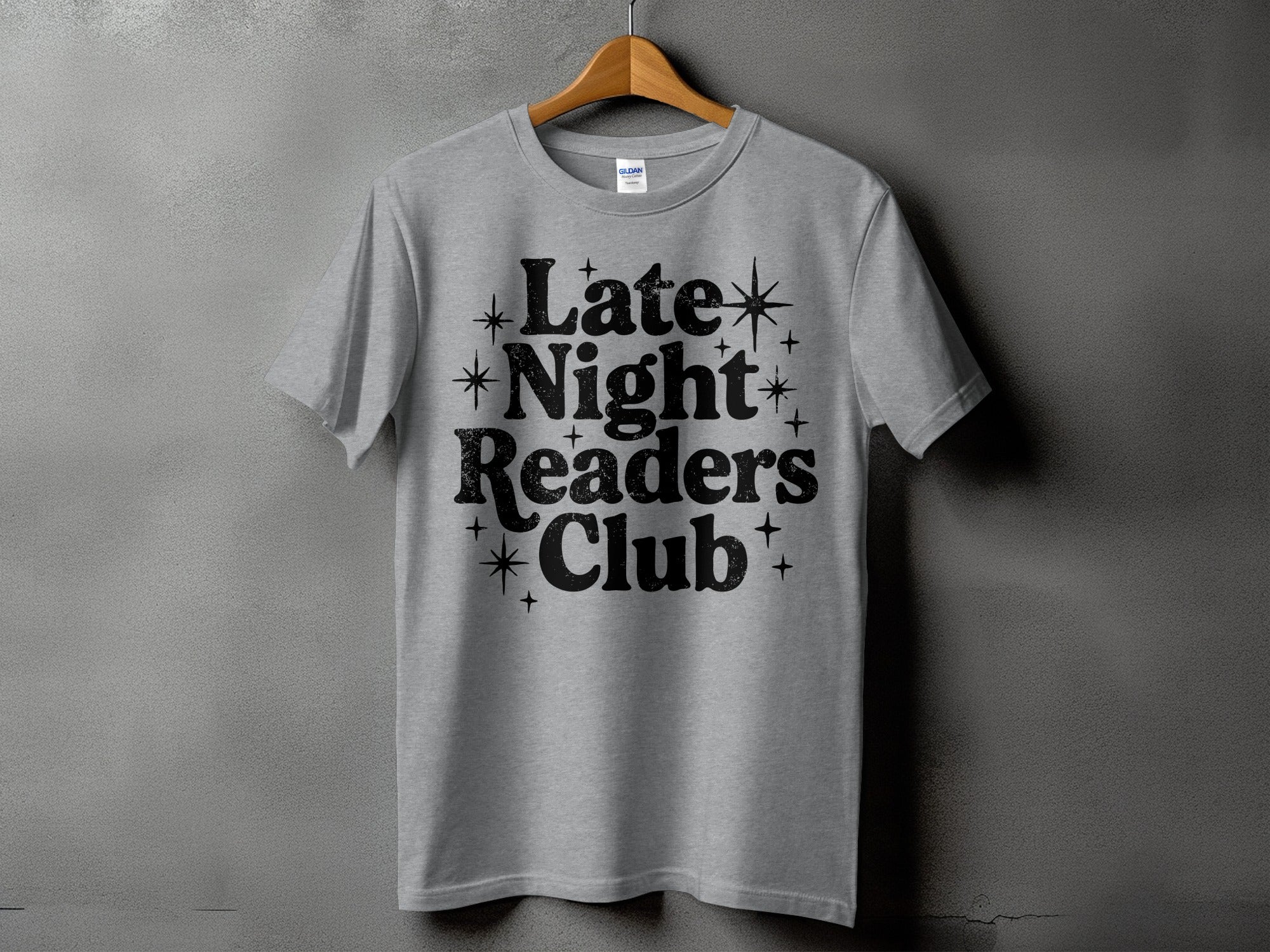 Grey t-shirt with black text reading "Late Night Readers Club".