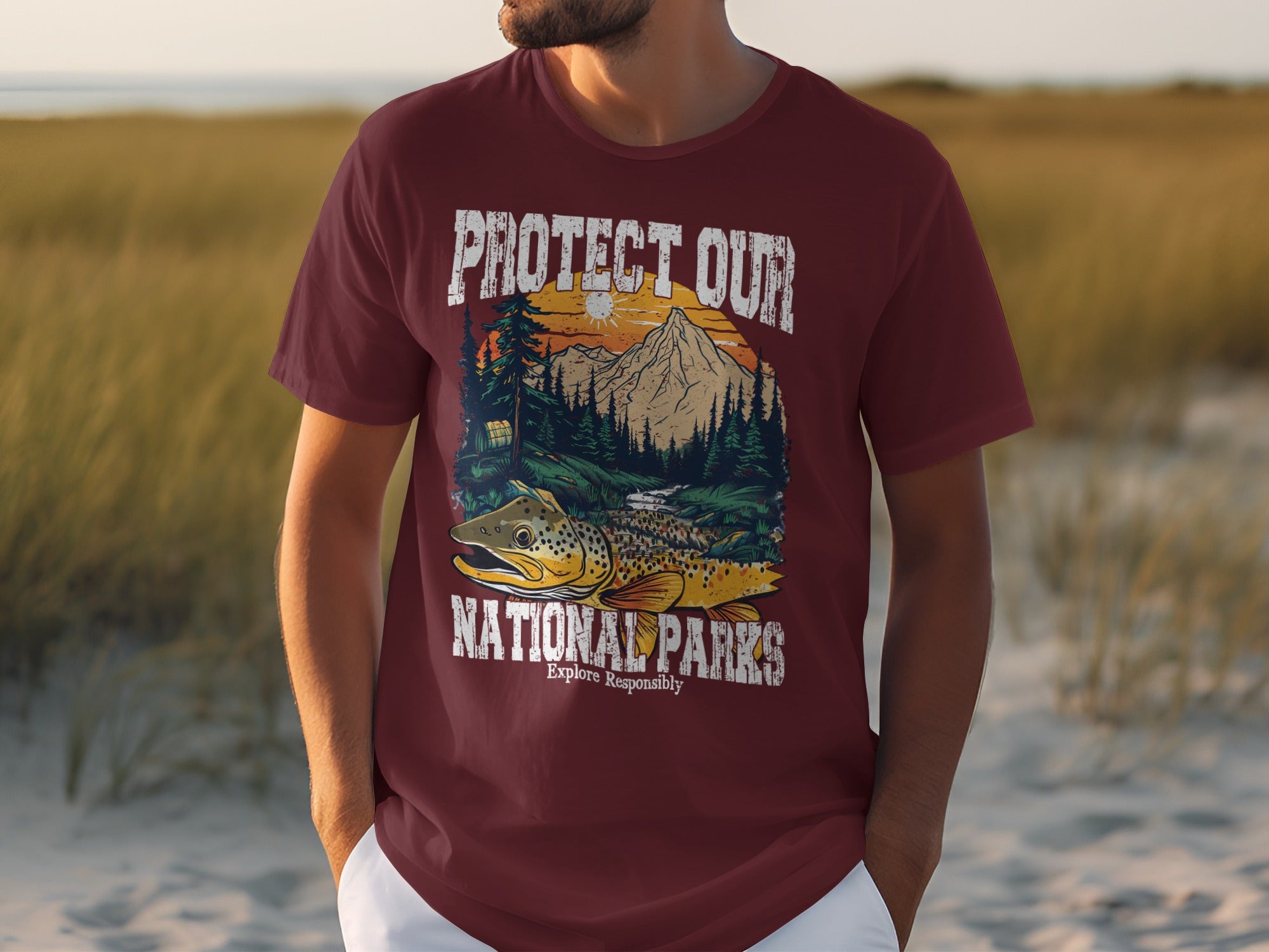 Maroon t-shirt with "Protect Our National Parks" graphic featuring a trout and mountain landscape.