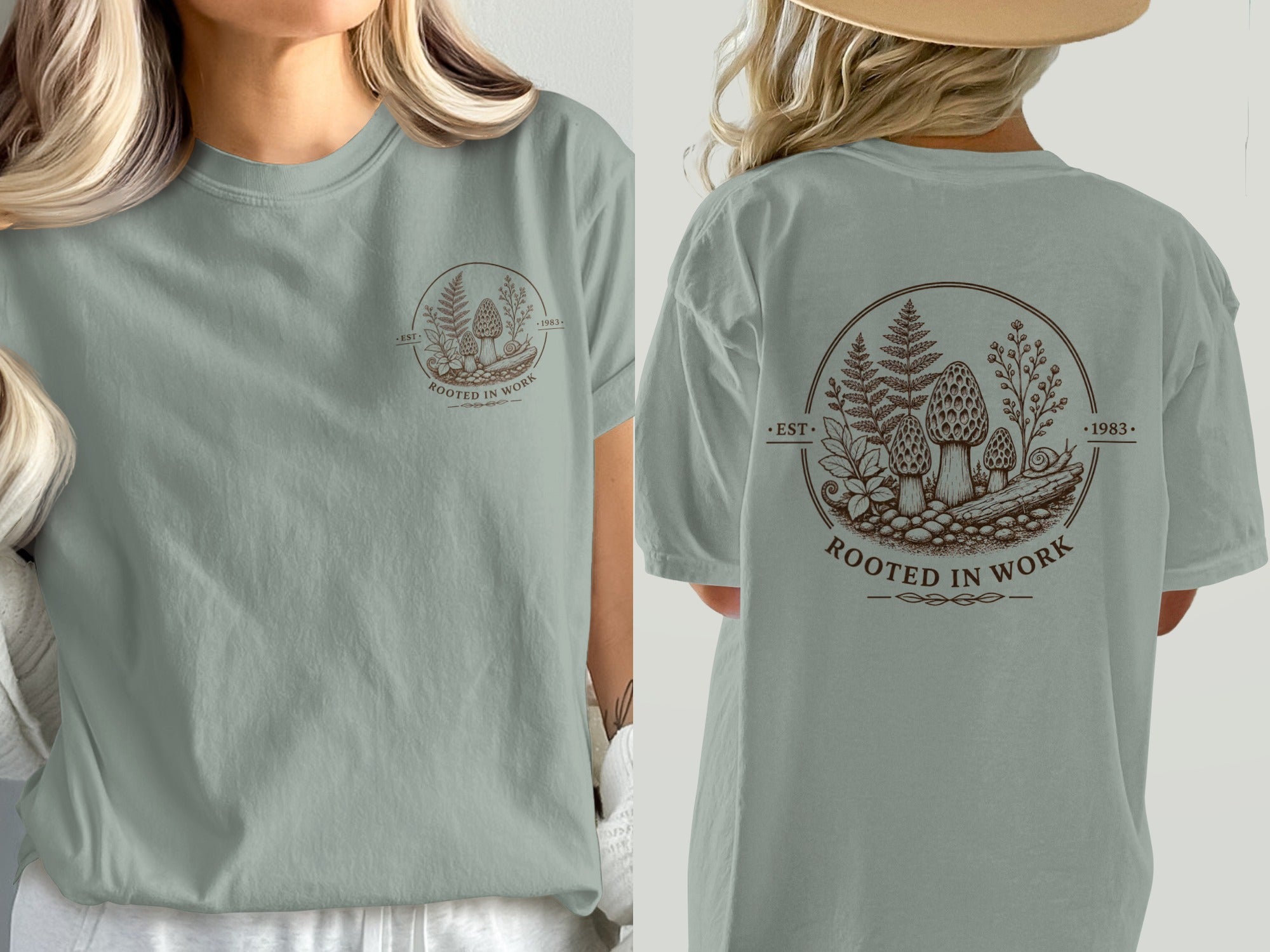 Green t-shirt with circular brown forest and mushroom graphic, "Rooted in Work 1983" text.