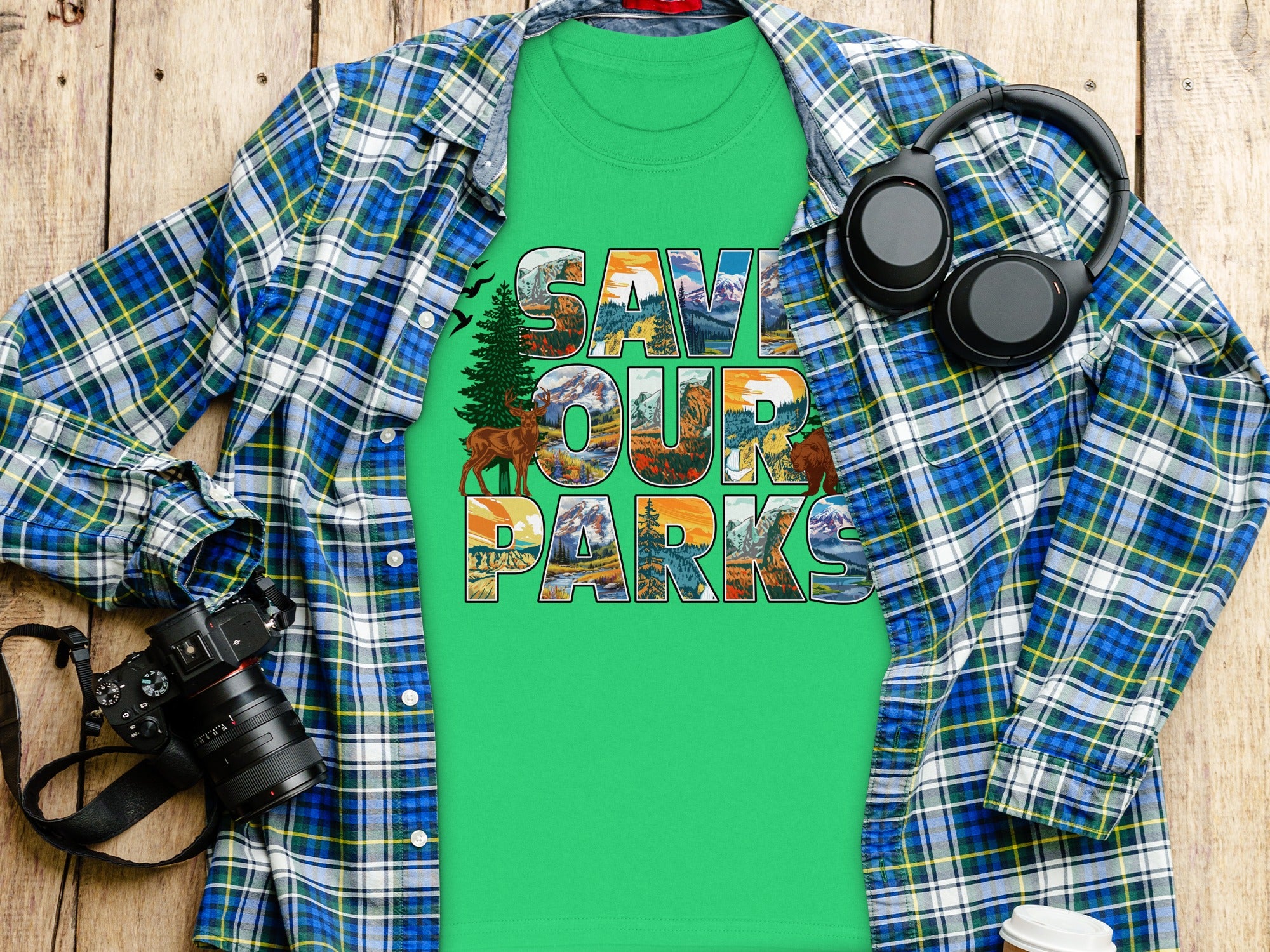 Green t-shirt with "SAVE OUR PARKS" text featuring nature scenes