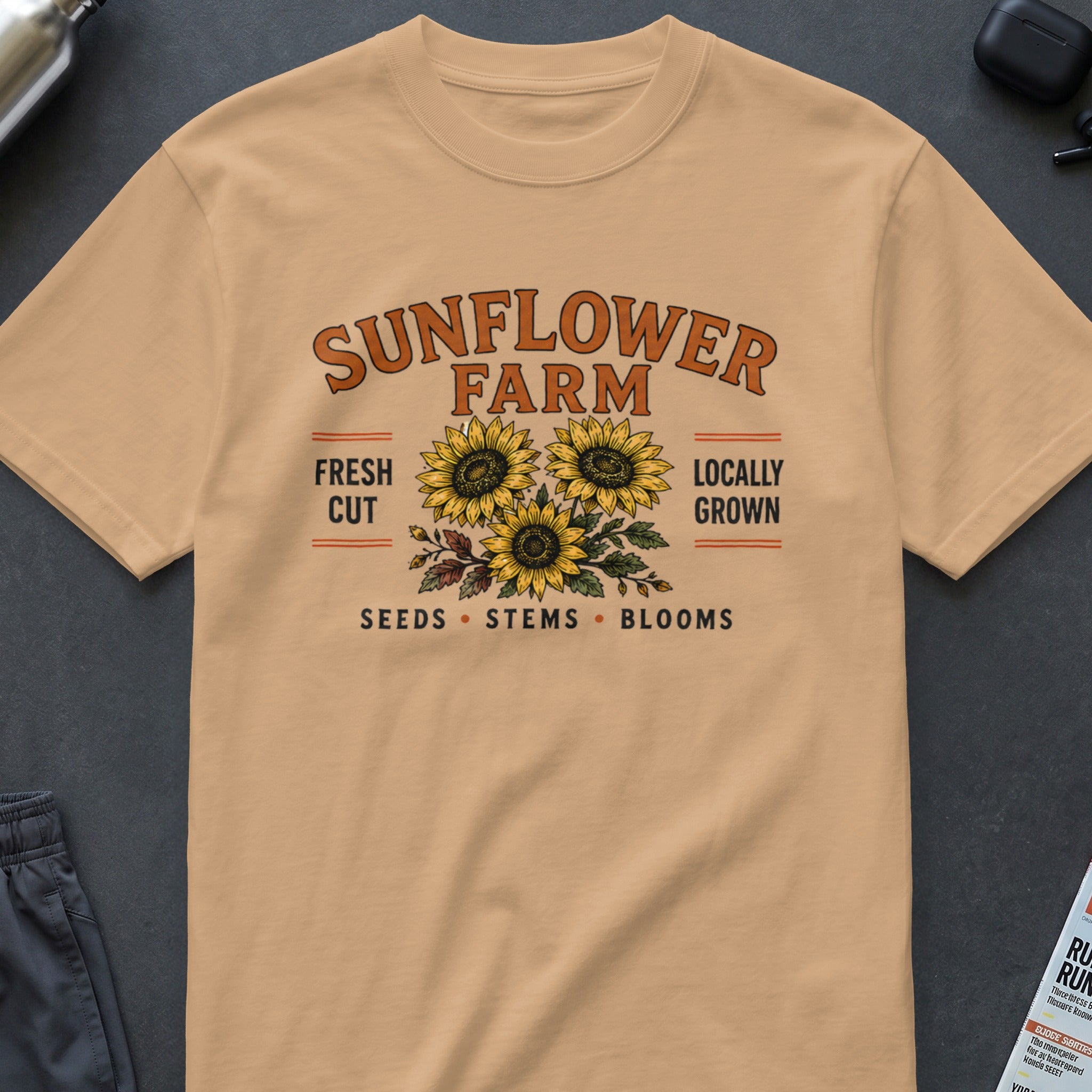 T-shirt featuring "Sunflower Farm" with three sunflowers, "Fresh Cut Locally Grown," and "Seeds Stems Blooms."