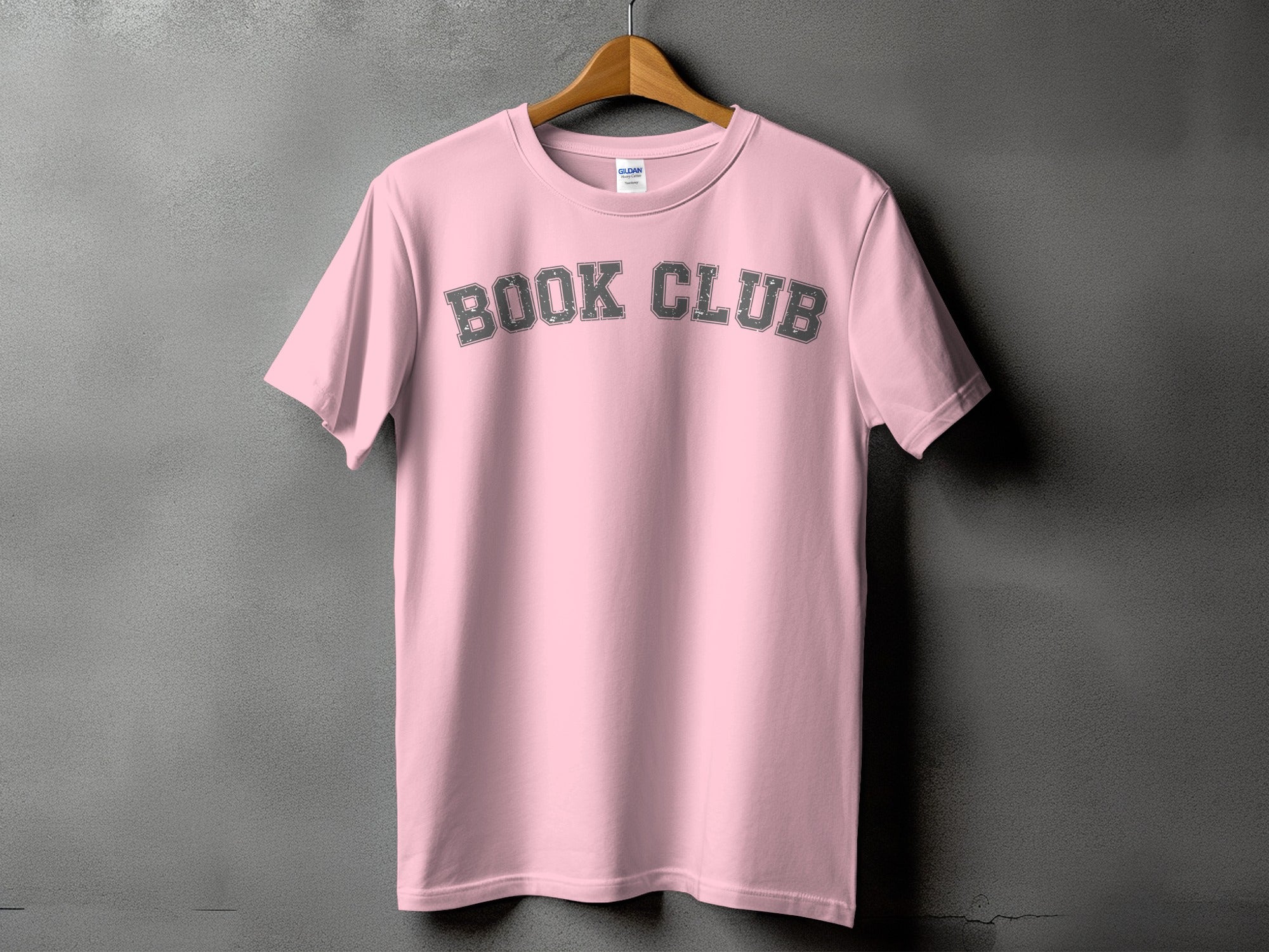 Pink t-shirt with "BOOK CLUB" text in distressed gray letters.
