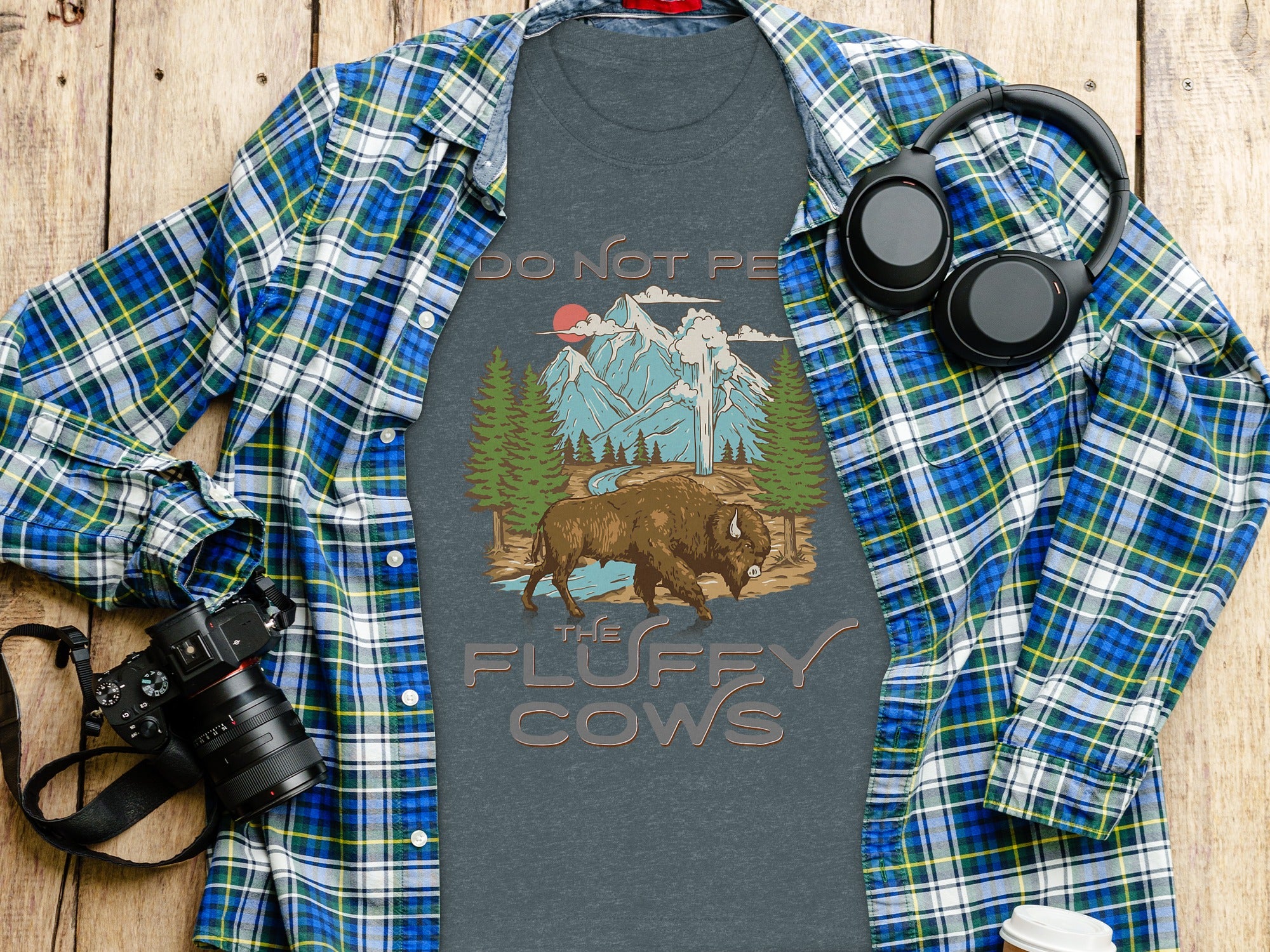 T-shirt with a bison and mountain graphic reads, "Do Not Pet The Fluffy Cows."