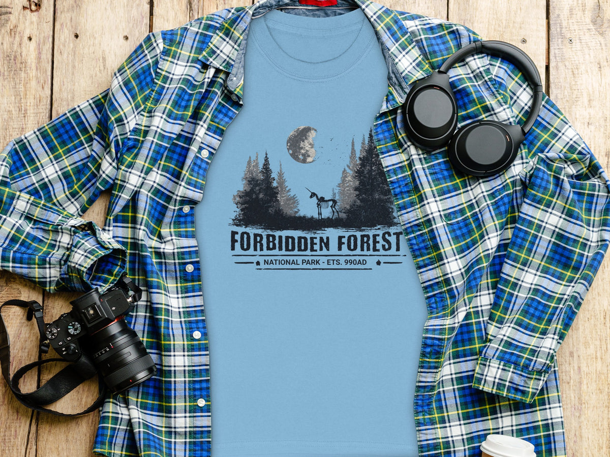 Blue t-shirt with Forbidden Forest National Park graphic and skeleton unicorn.