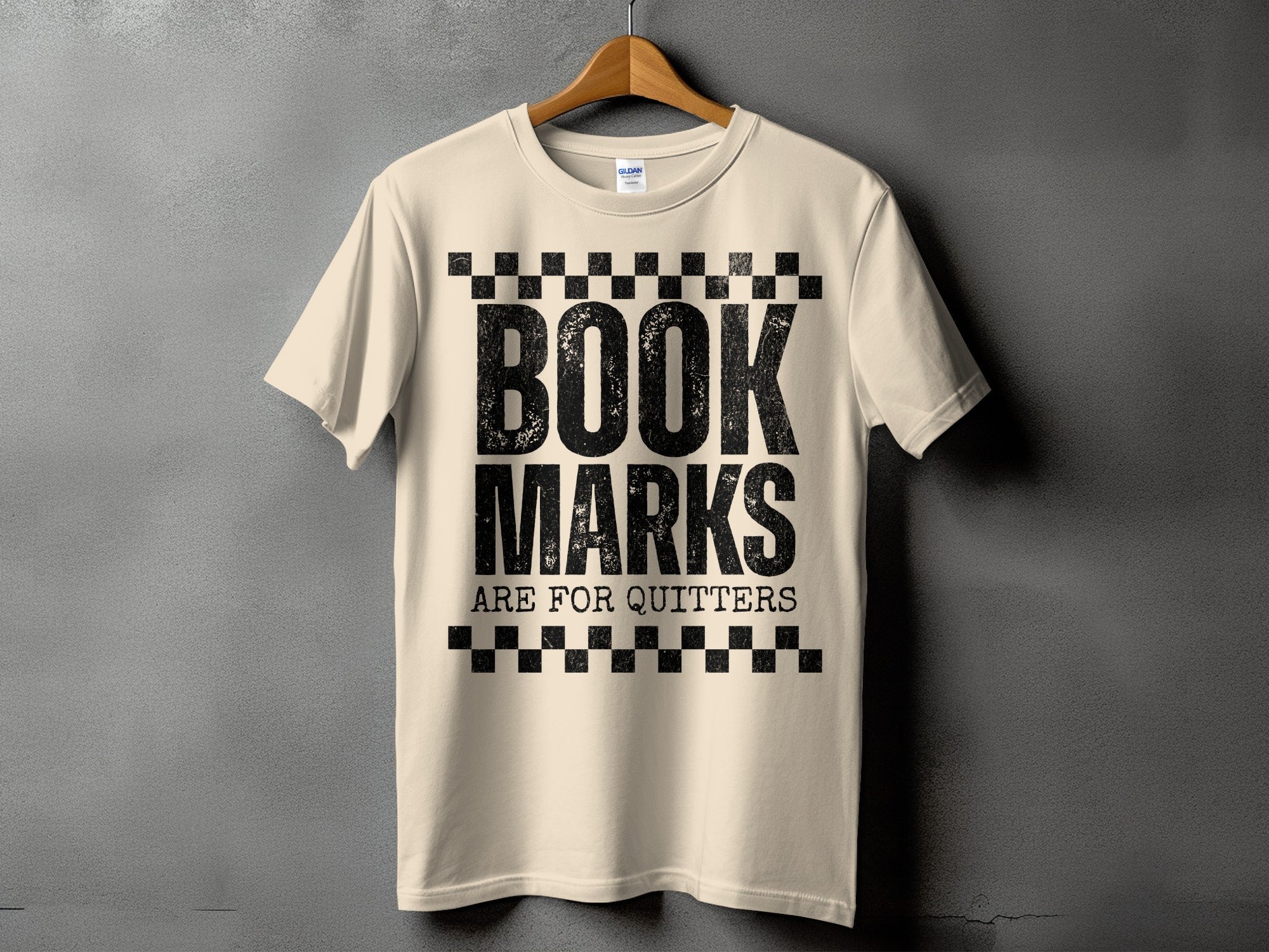 Cream t-shirt with black text "BOOK MARKS ARE FOR QUITTERS"