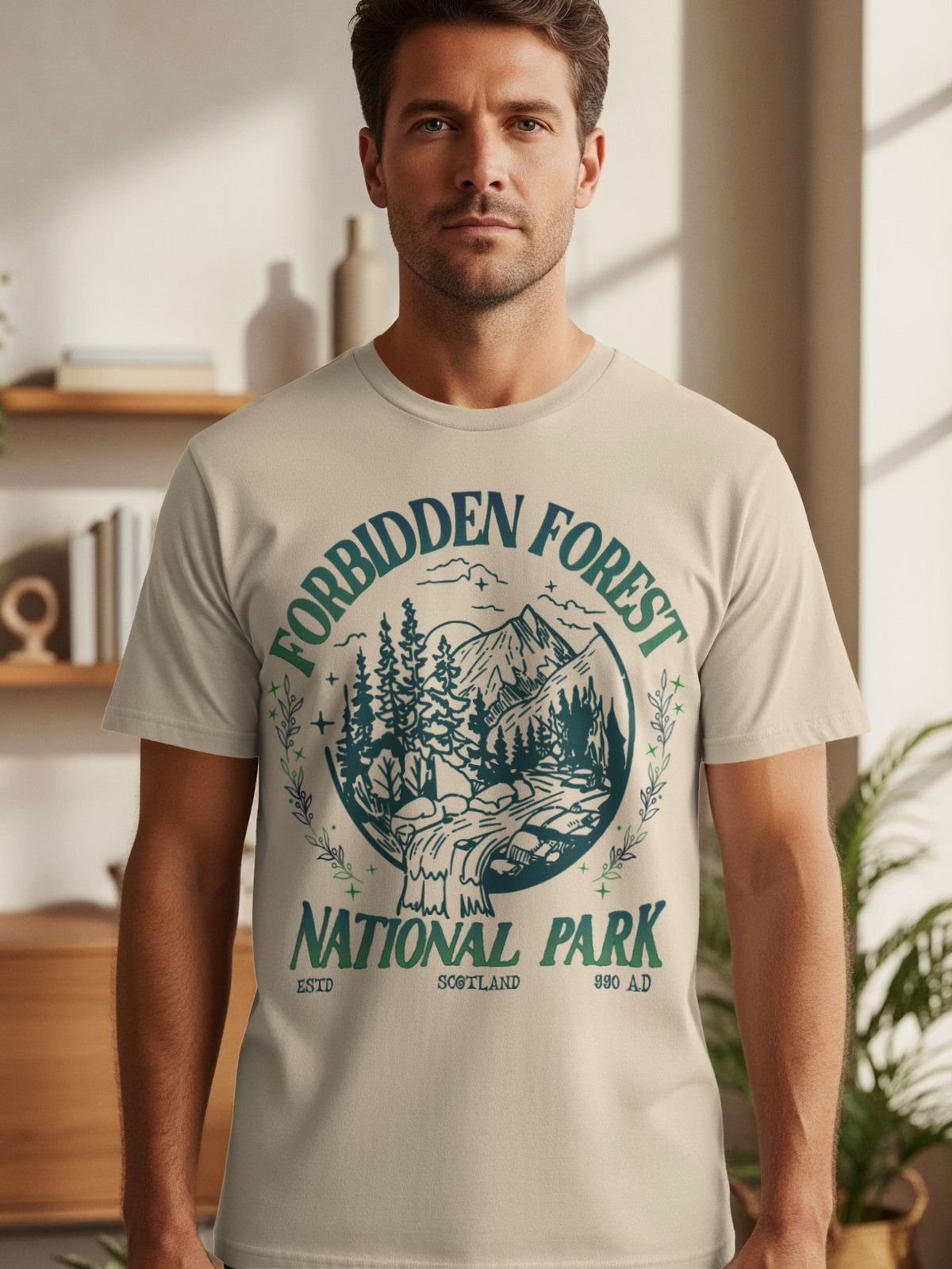 T-shirt with circular graphic: "Forbidden Forest National Park" with trees, mountains, and waterfall.