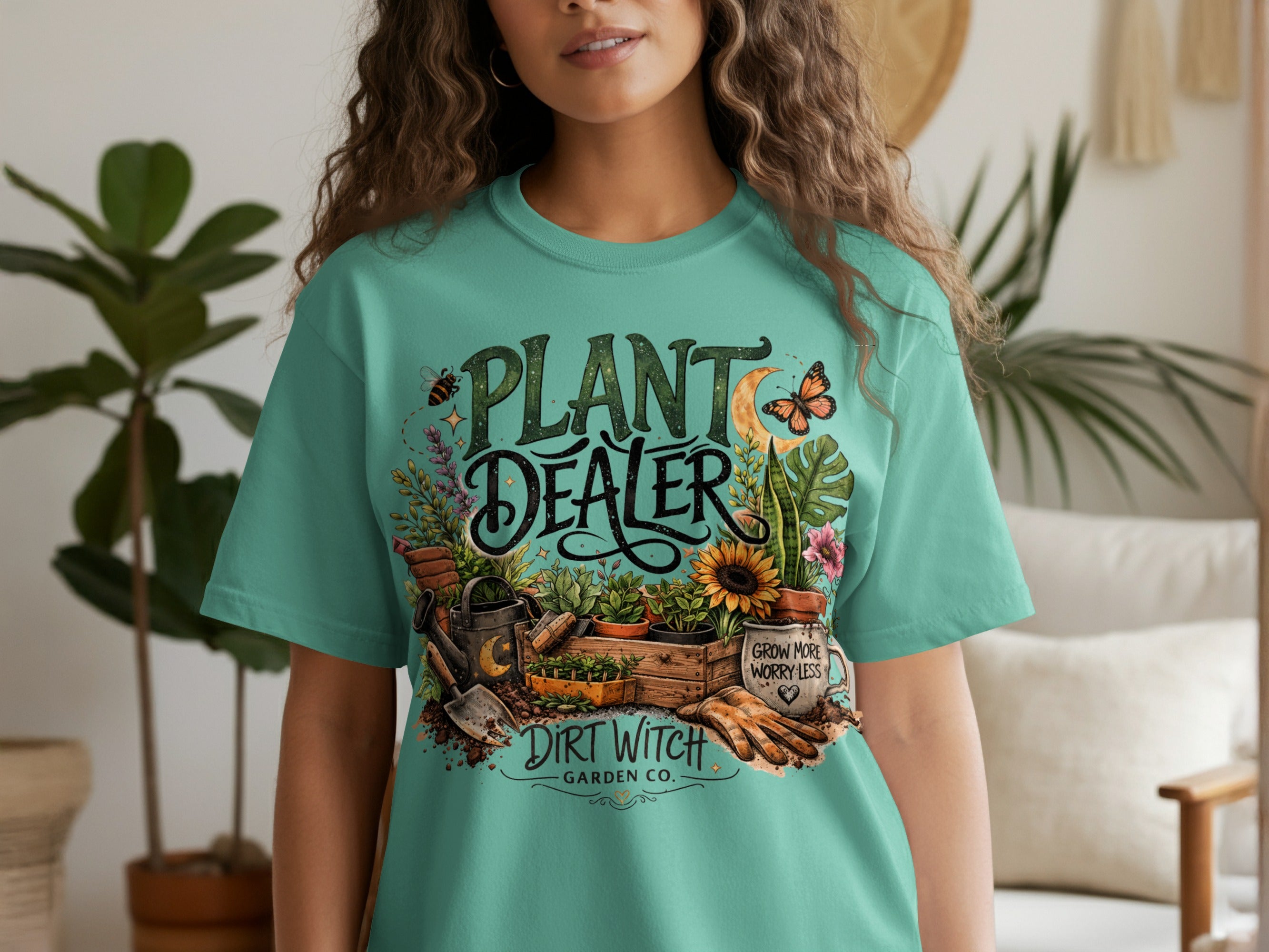 Teal t-shirt with "Plant Dealer" graphic featuring gardening tools, plants, and insects.