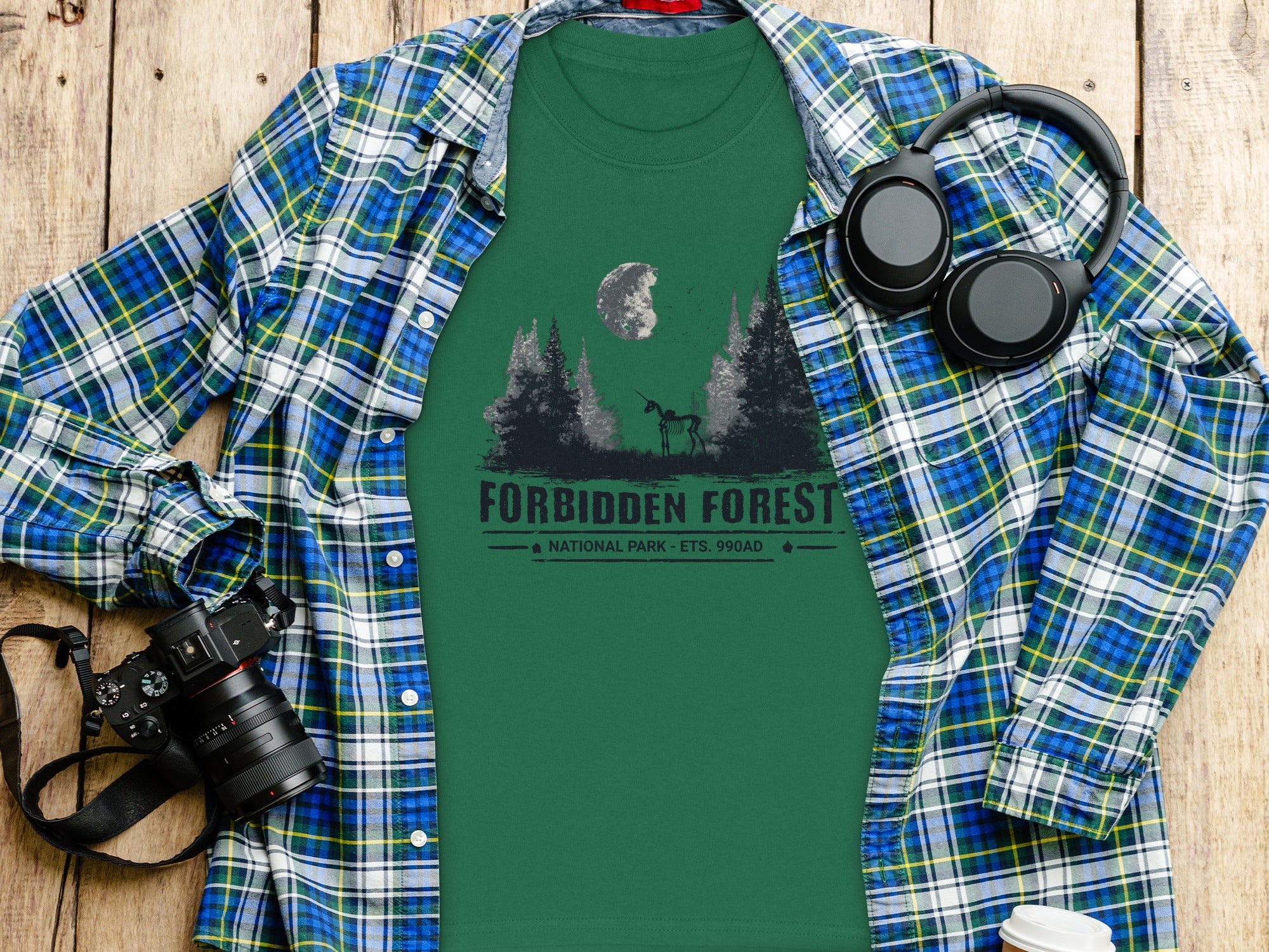 Green t-shirt with "Forbidden Forest National Park" text and a skeletal unicorn.