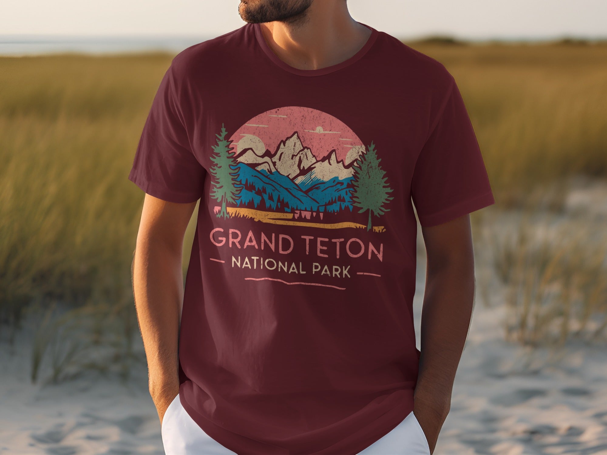 Maroon t-shirt graphic featuring Grand Teton National Park landscape with text.