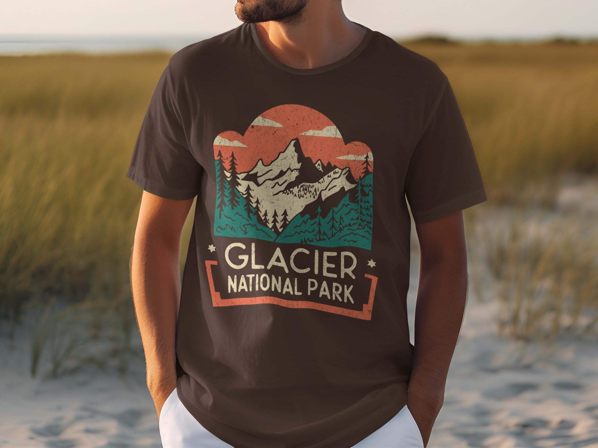 Brown t-shirt with Glacier National Park mountain and trees graphic.