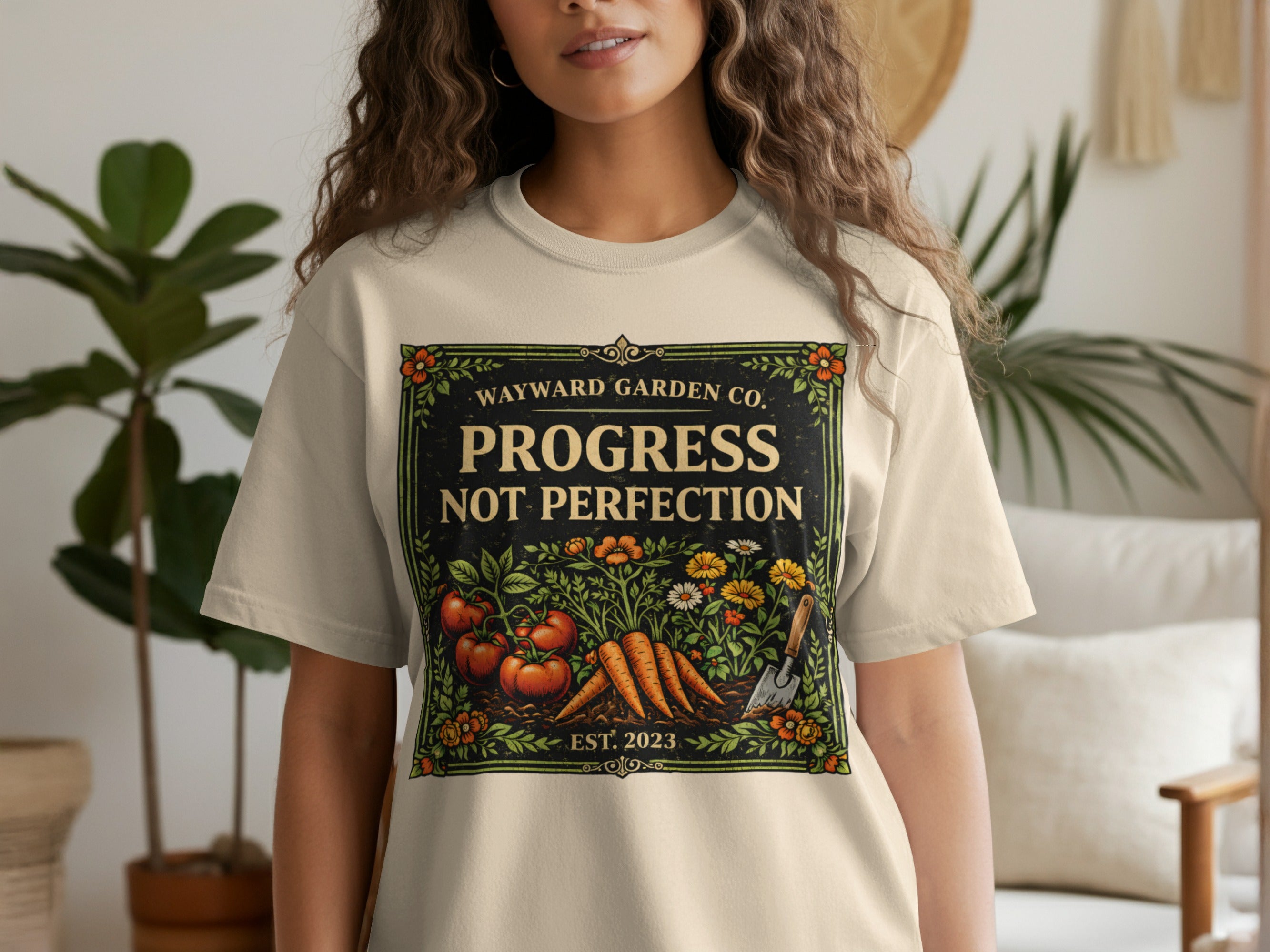 T-shirt with "Wayward Garden Co. Progress Not Perfection" text and garden illustration.