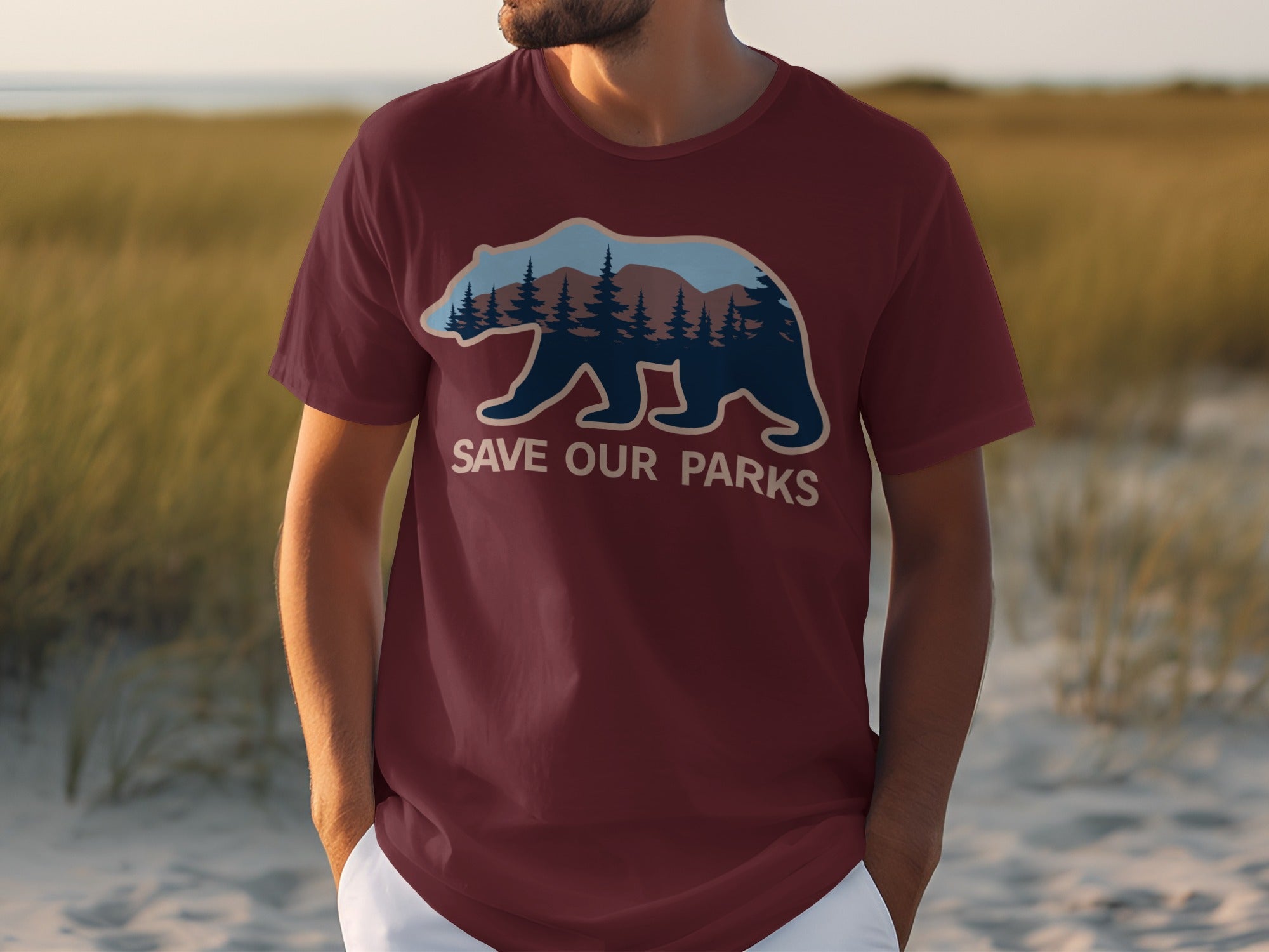 Maroon t-shirt with a bear silhouette filled with forest and mountains, text reads "SAVE OUR PARKS".