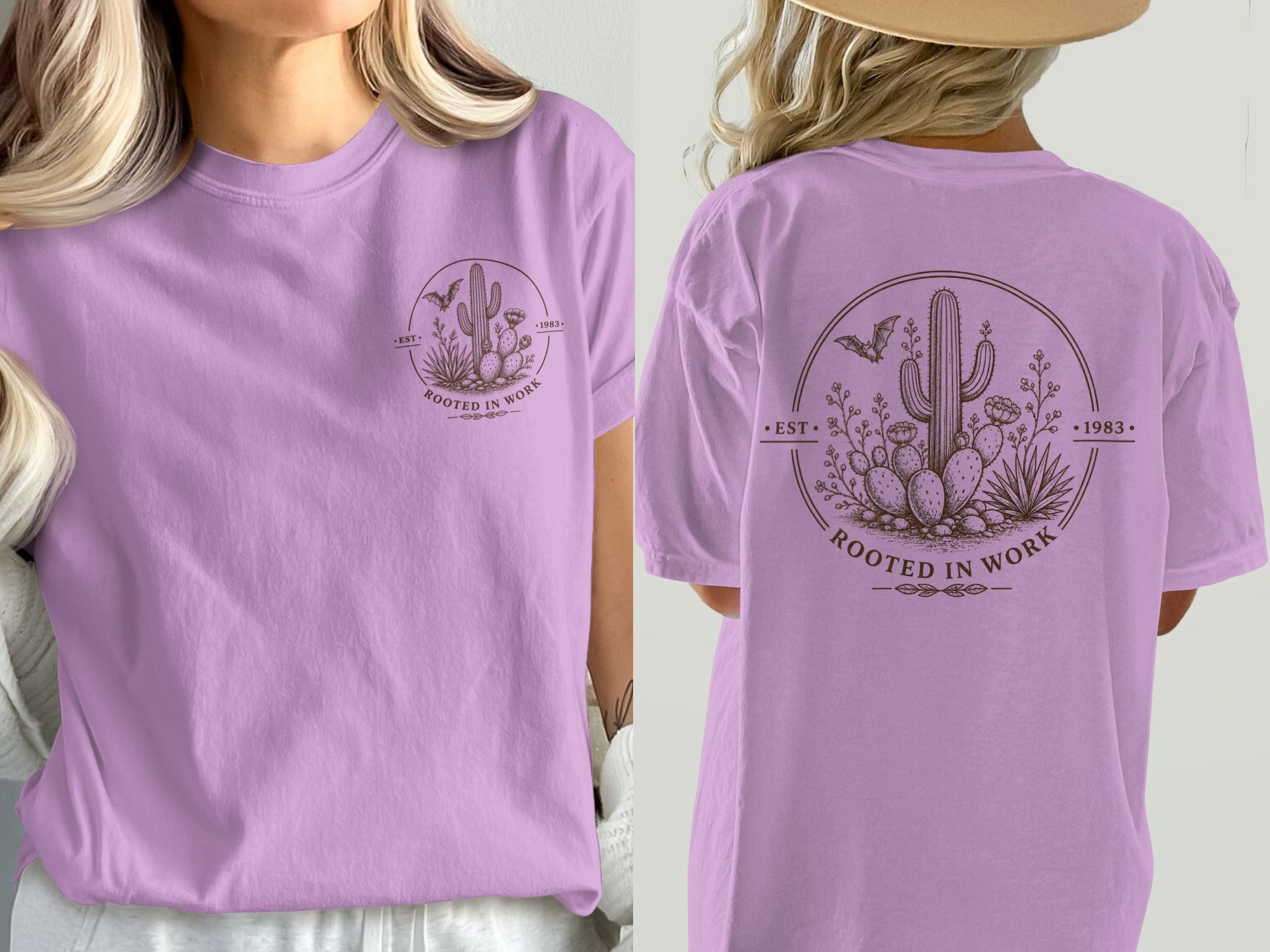 Lavender t-shirt with a circular graphic of cacti, bats, and desert plants, reading "EST• ROOTED IN WORK •1983".