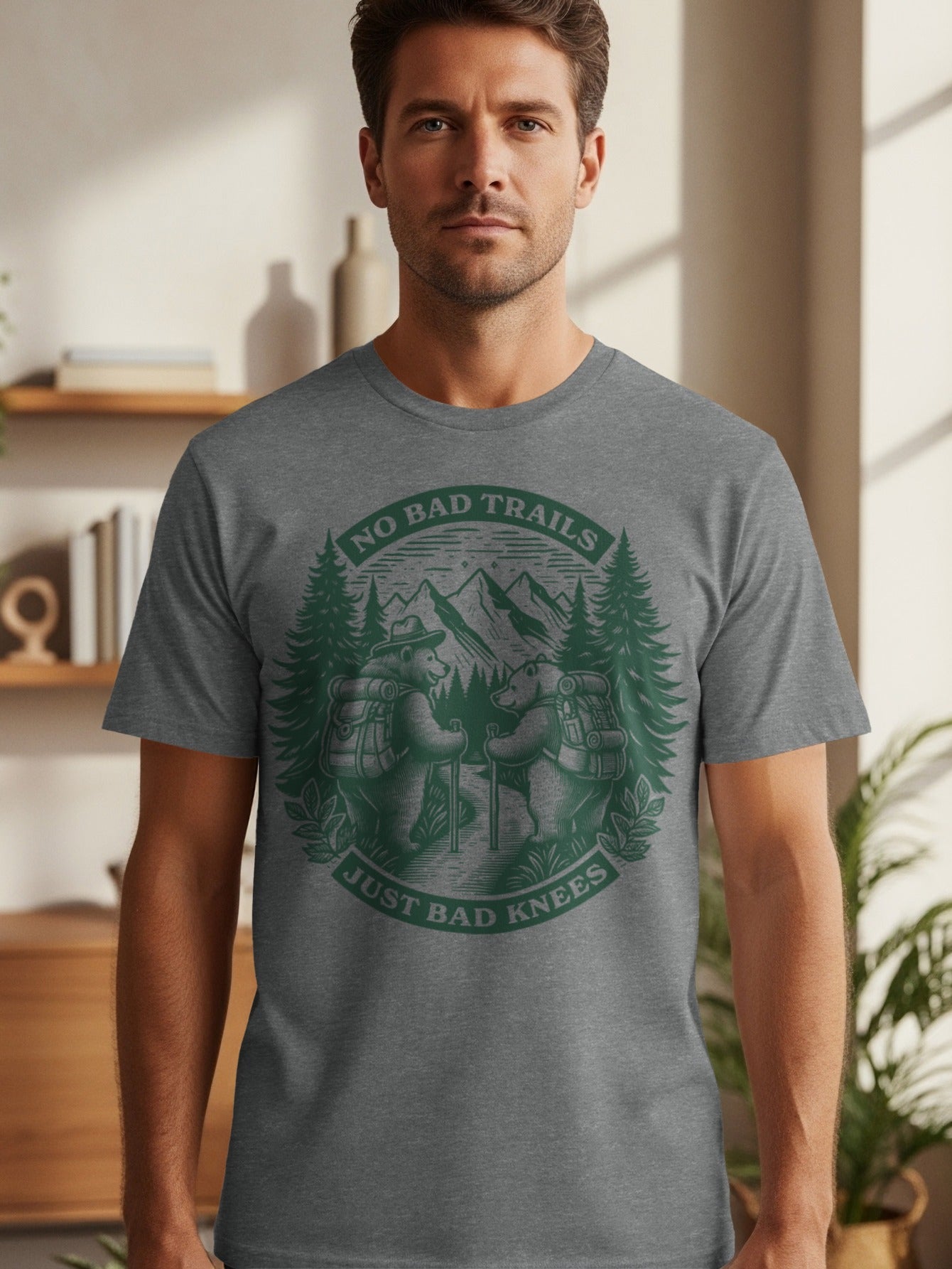 T-shirt graphic with bears hiking, mountains, trees, and text "No Bad Trails Just Bad Knees".