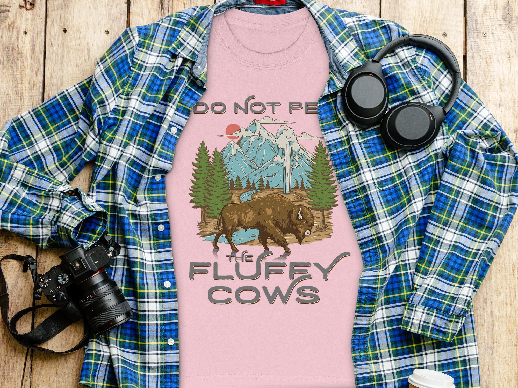 Pink t-shirt with a bison, mountains, and text "DO NOT PE THE FLUFFY COWS".
