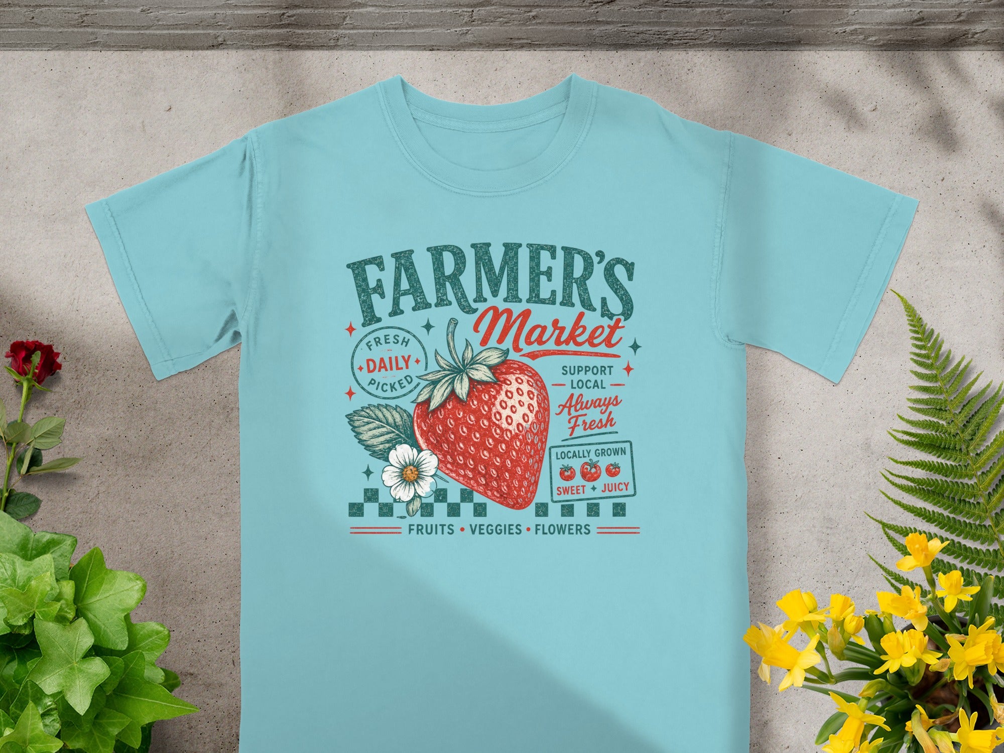 Light blue t-shirt with "Farmer's Market" graphic featuring a strawberry and floral elements.