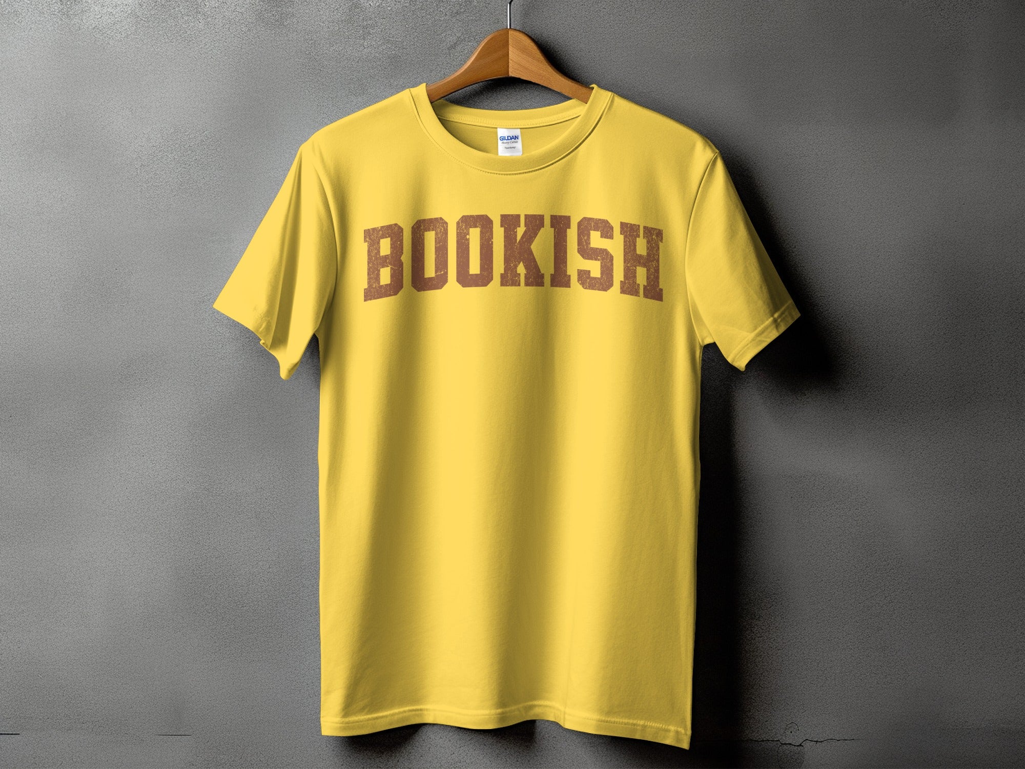 Yellow t-shirt with distressed brown "BOOKISH" text across chest.