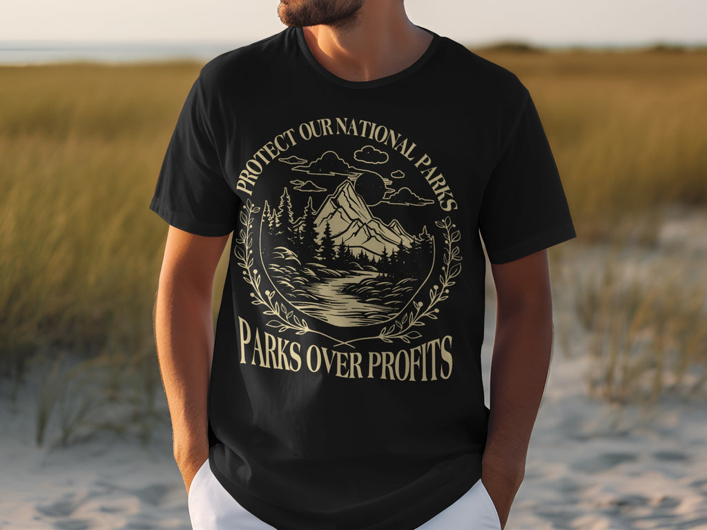 Black t-shirt with graphic reading "Protect Our National Parks Parks Over Profits".